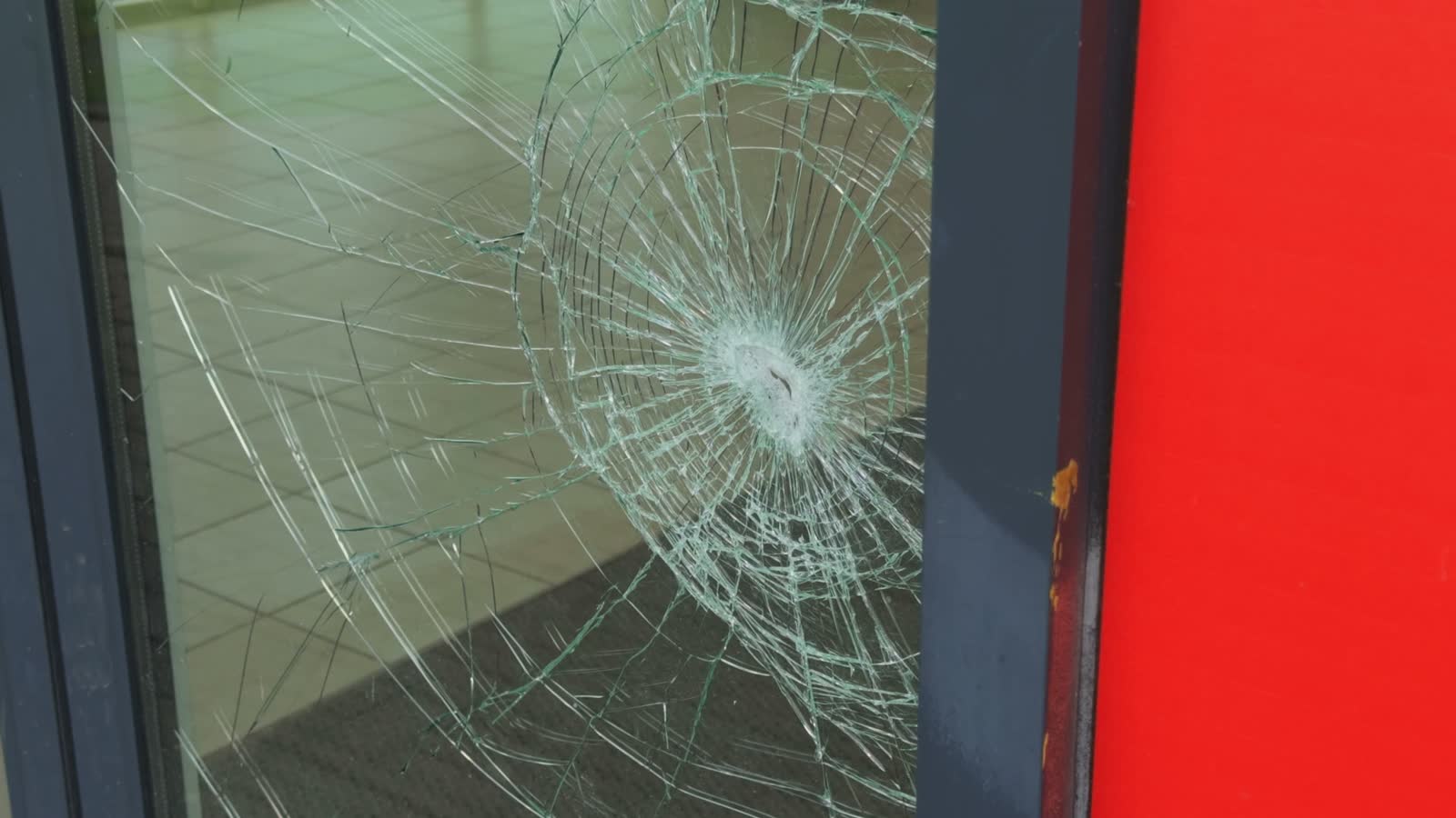 a-closeup-view-of-a-cracked-glass-door-featuring-a.mp4