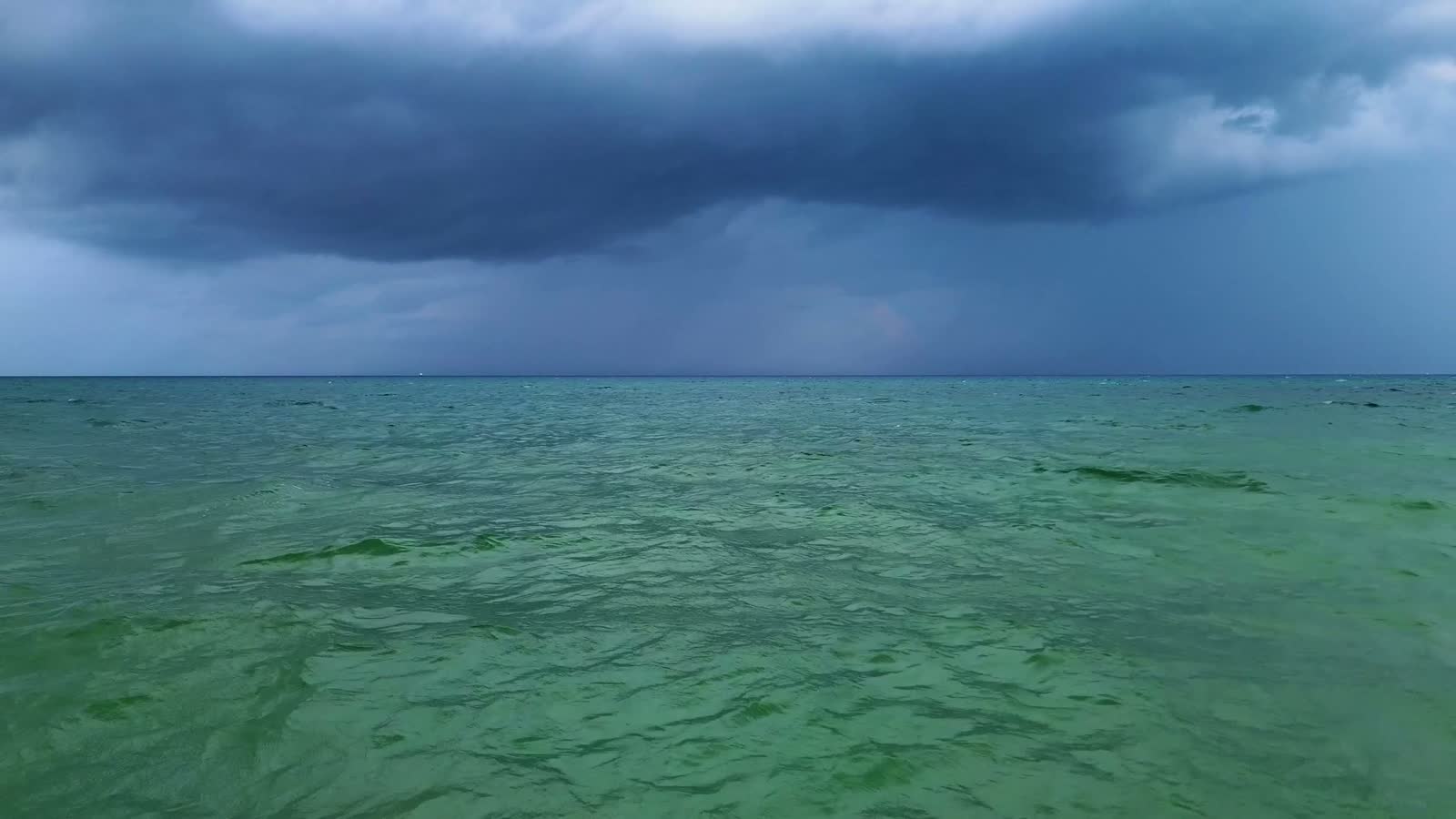 a-storm-brewing-over-the-ocean-along-the-beach.mp4