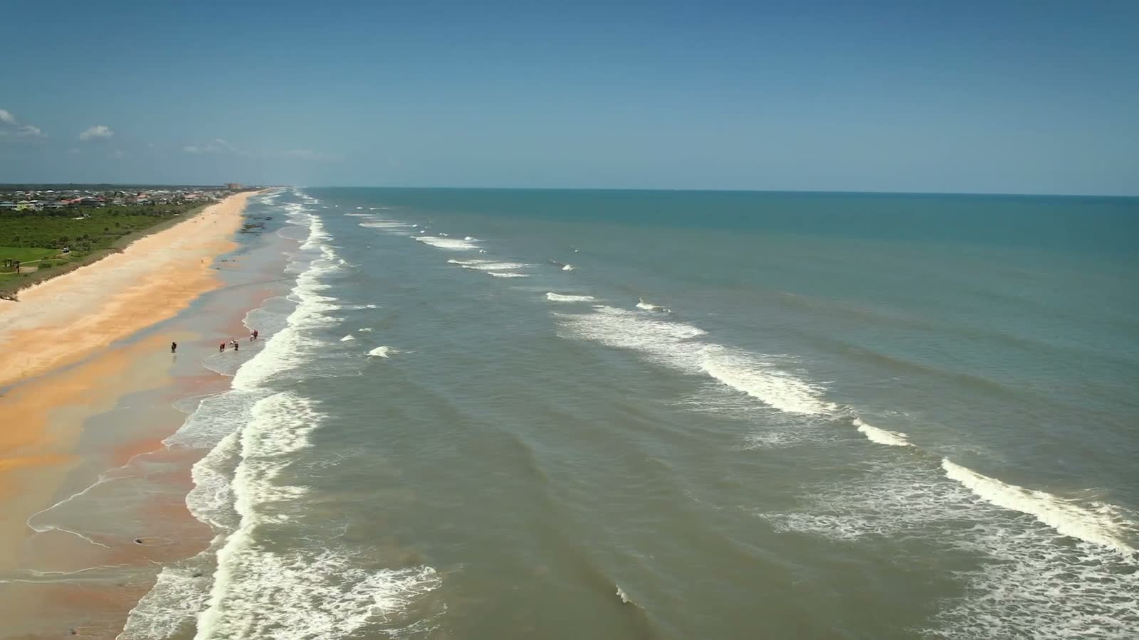 aerial-drone-footage-of-horseback-riding-and-waves.mp4