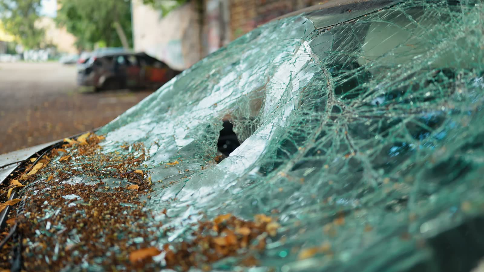 damaged-car-with-broken-windshield-in-urban-enviro.mp4