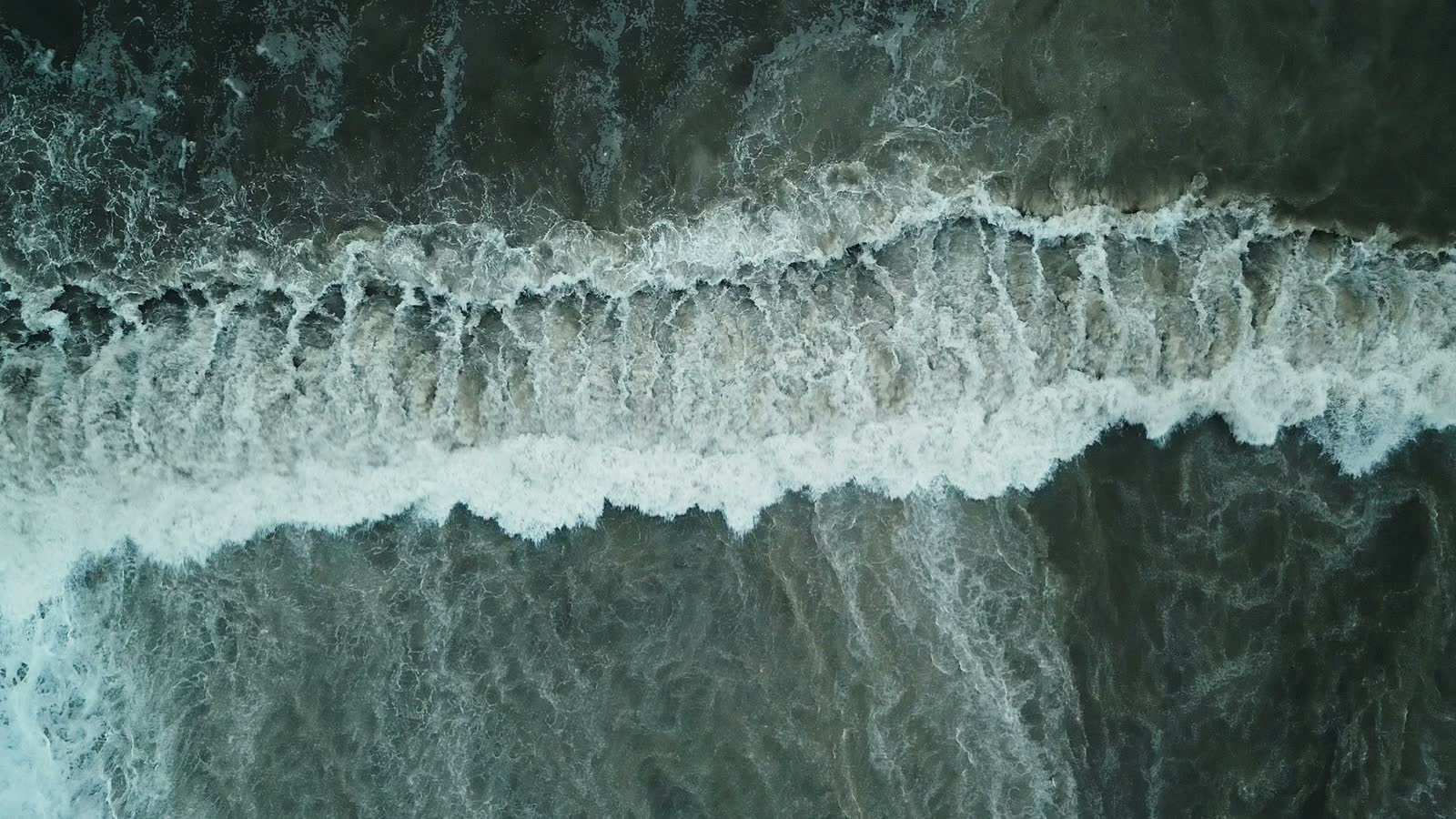 dirty-stormy-sea-waves-crash-on-the-shore.mp4