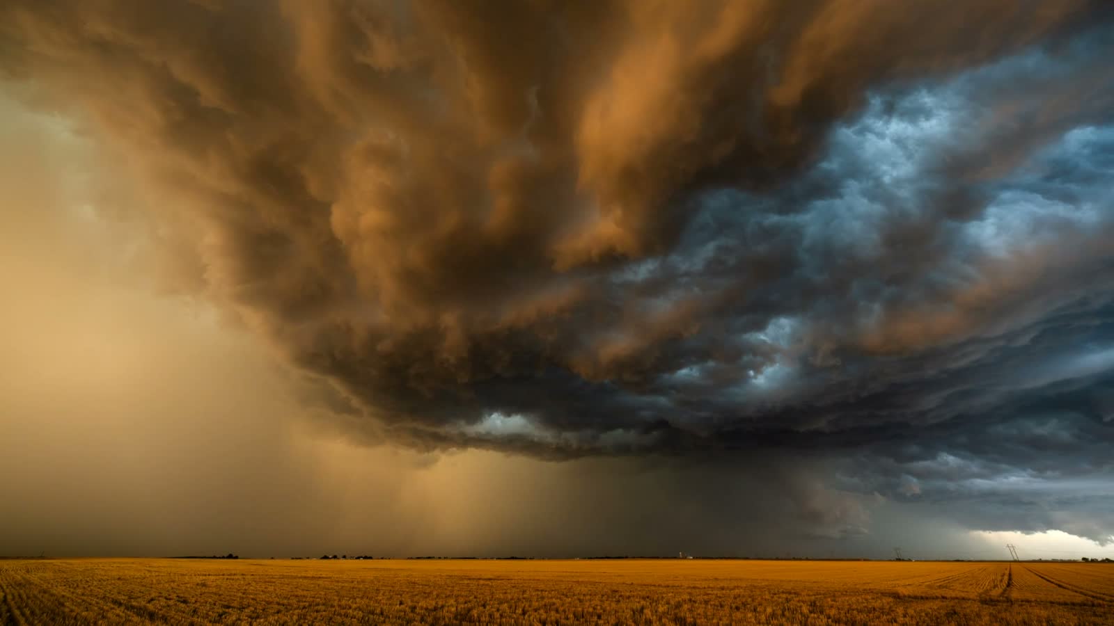 dramatic-storm-clouds-rolling-over-rural-field.mp4
