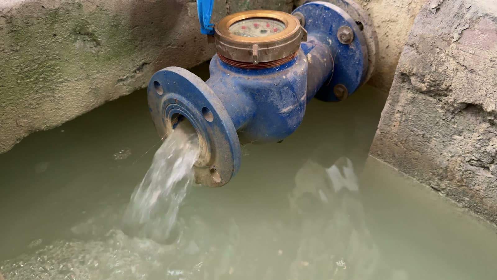 flowing-water-meter-in-concrete-canal-environment.mp4