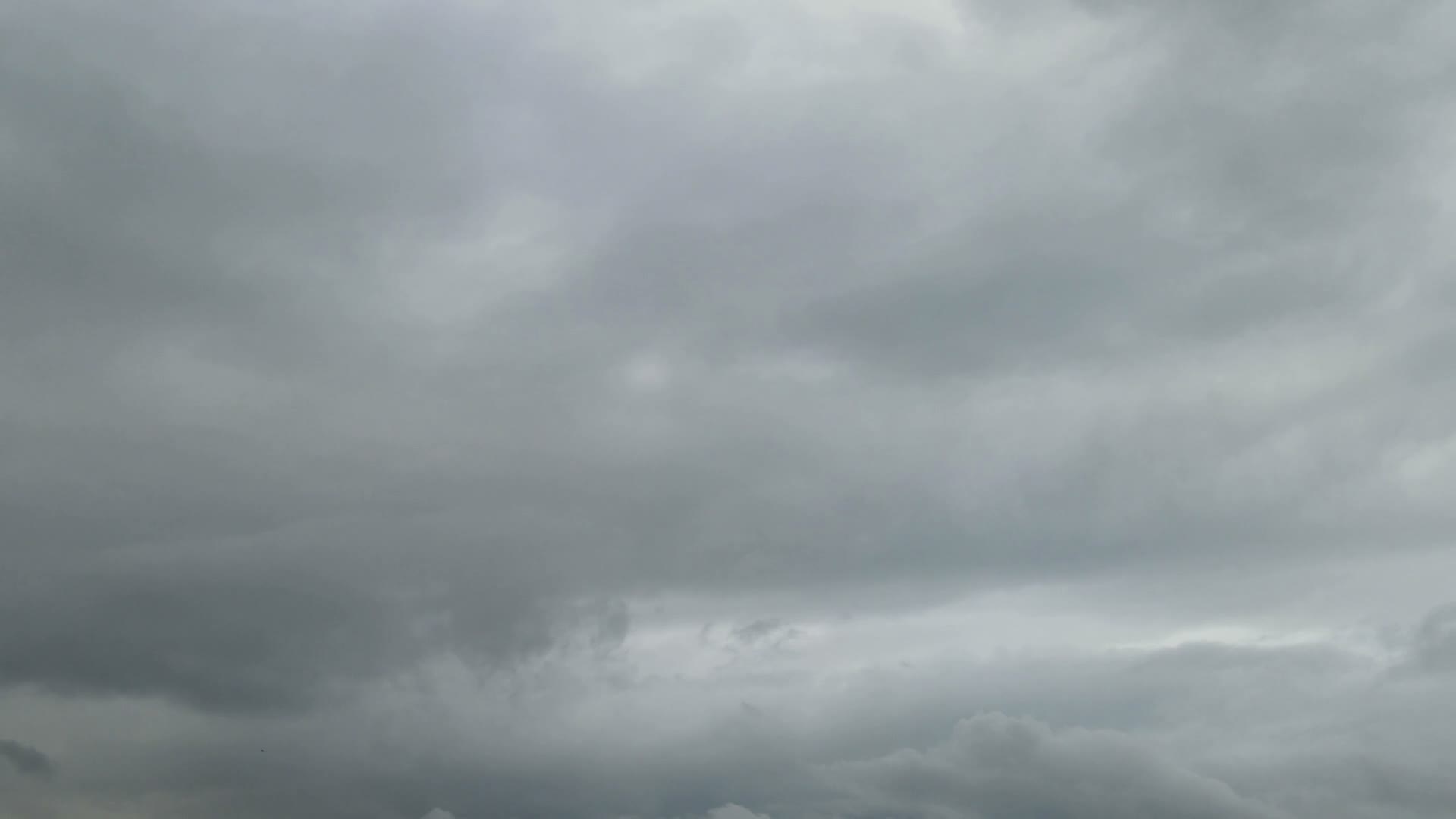 gray-storm-clouds-drifting-slowly-across-sky.mp4