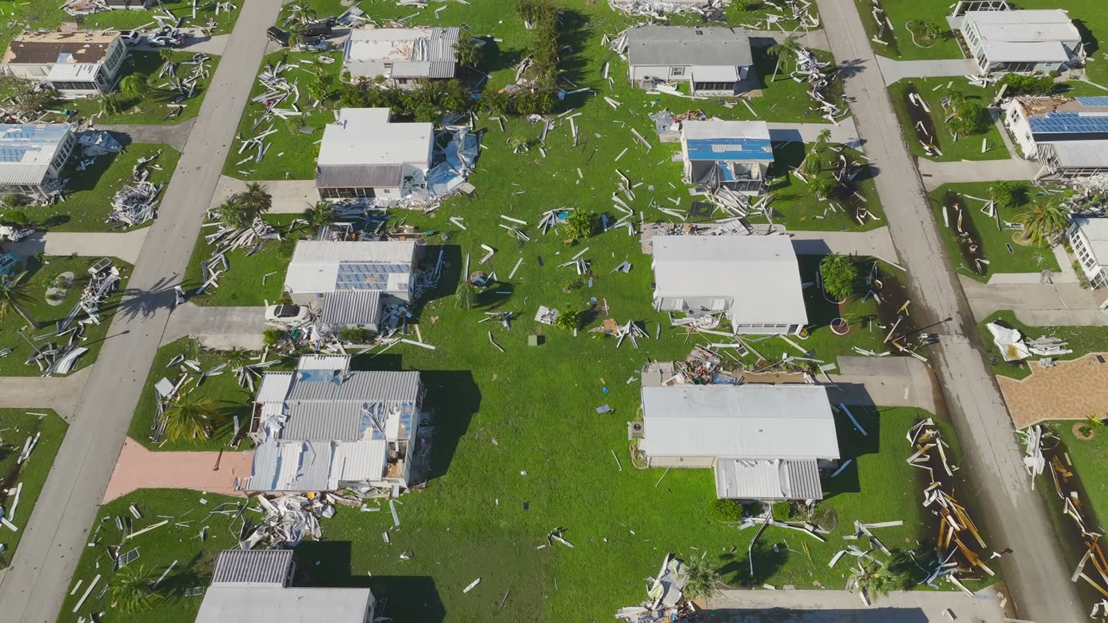 A Florida suburban street of houses destroyed by Hurricane Ian, the scale of loss behind a Fla. Stat. 624.155 bad-faith claim