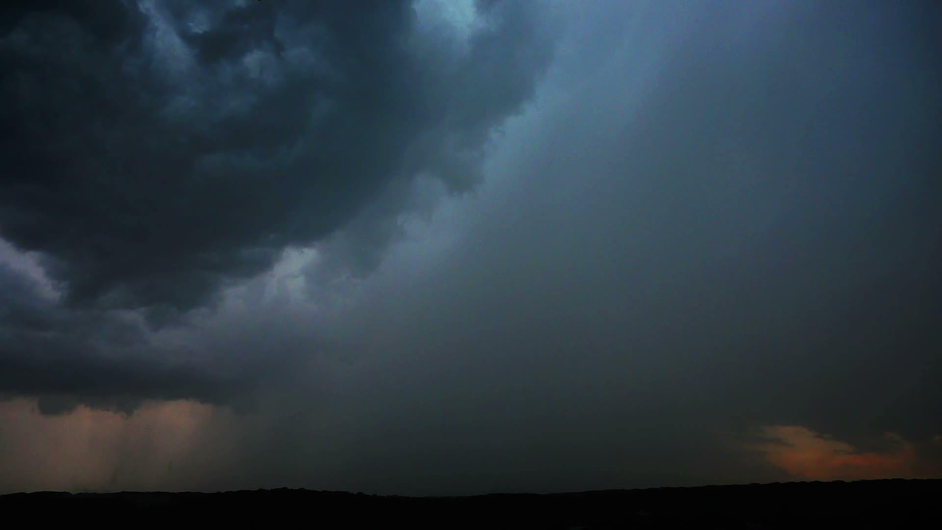 A bright lightning bolt striking during a dramatic night storm
