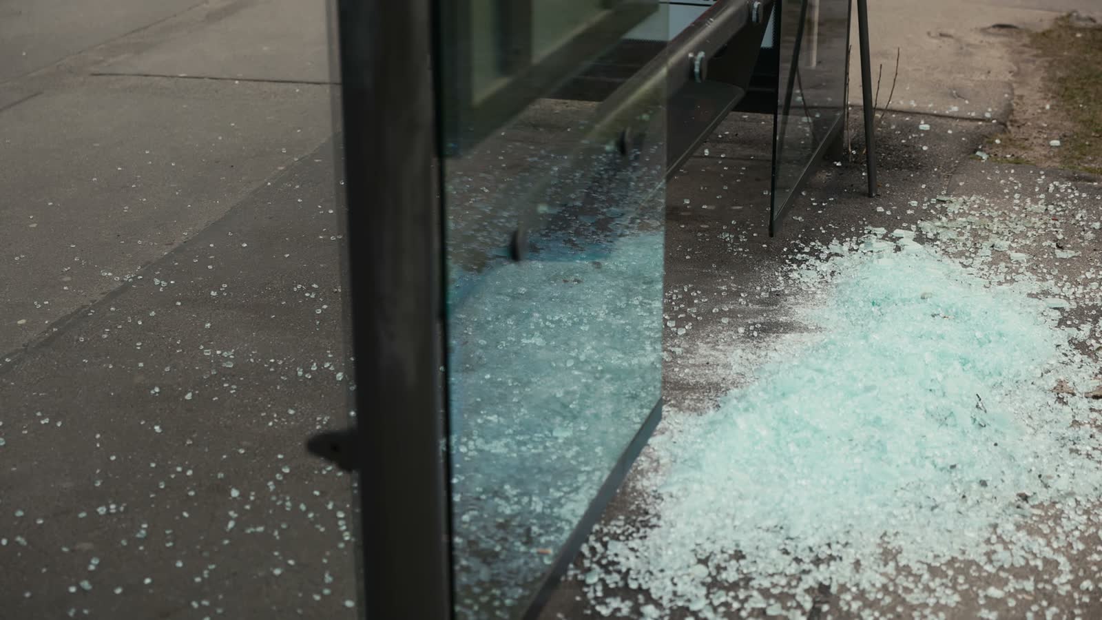 shattered-glass-window-rests-on-ground-near-buildi.mp4