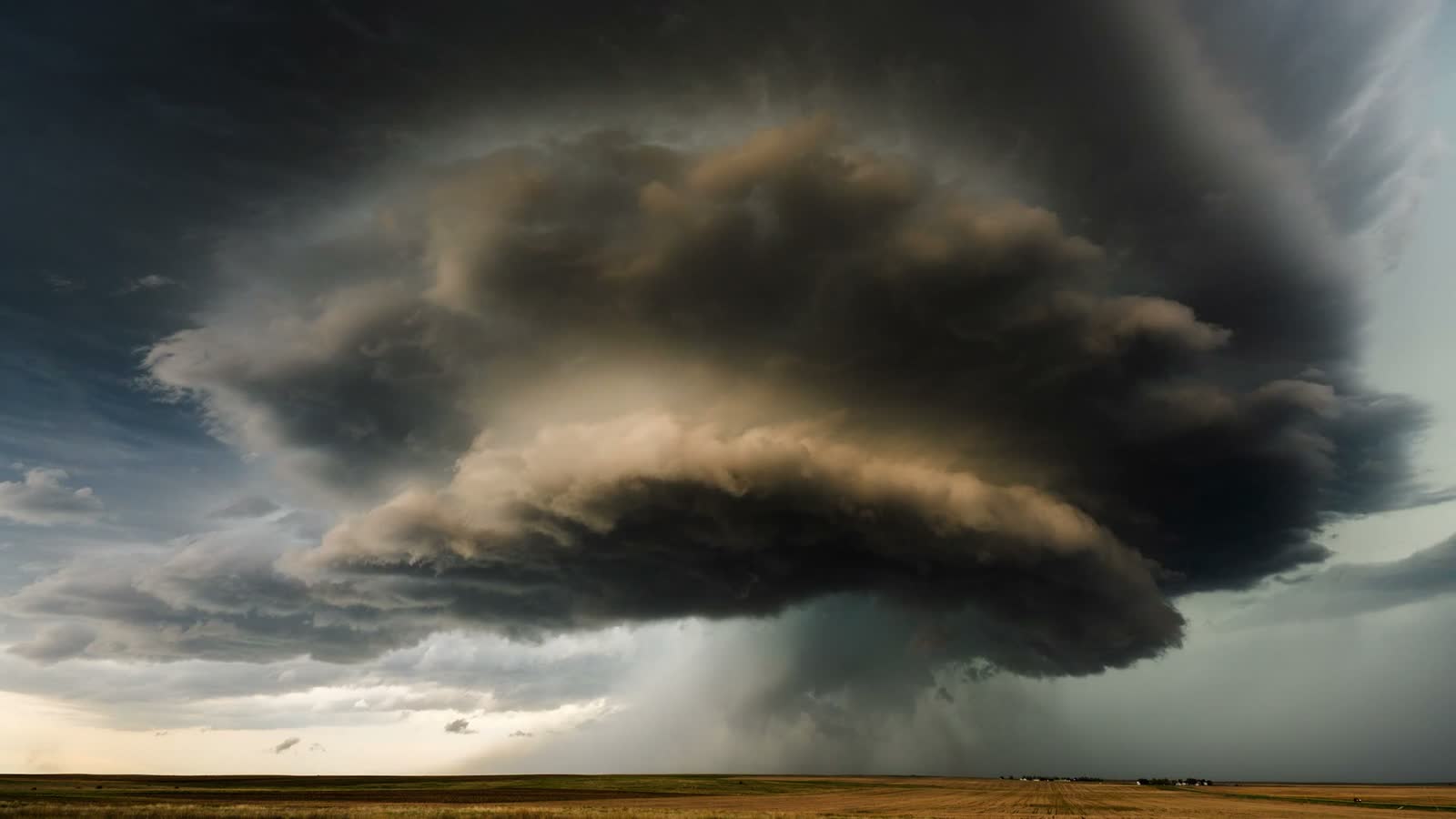 storm-clouds-looming-over-golden-prairie-landscape.mp4