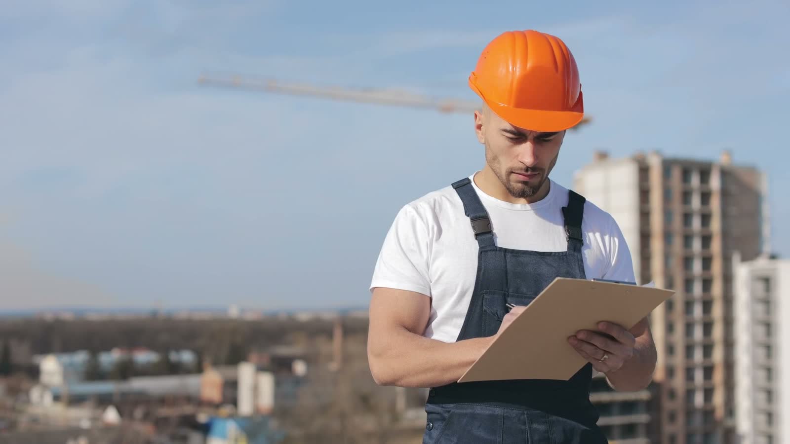 construction-worker-taking-notes-on-building-site.mp4