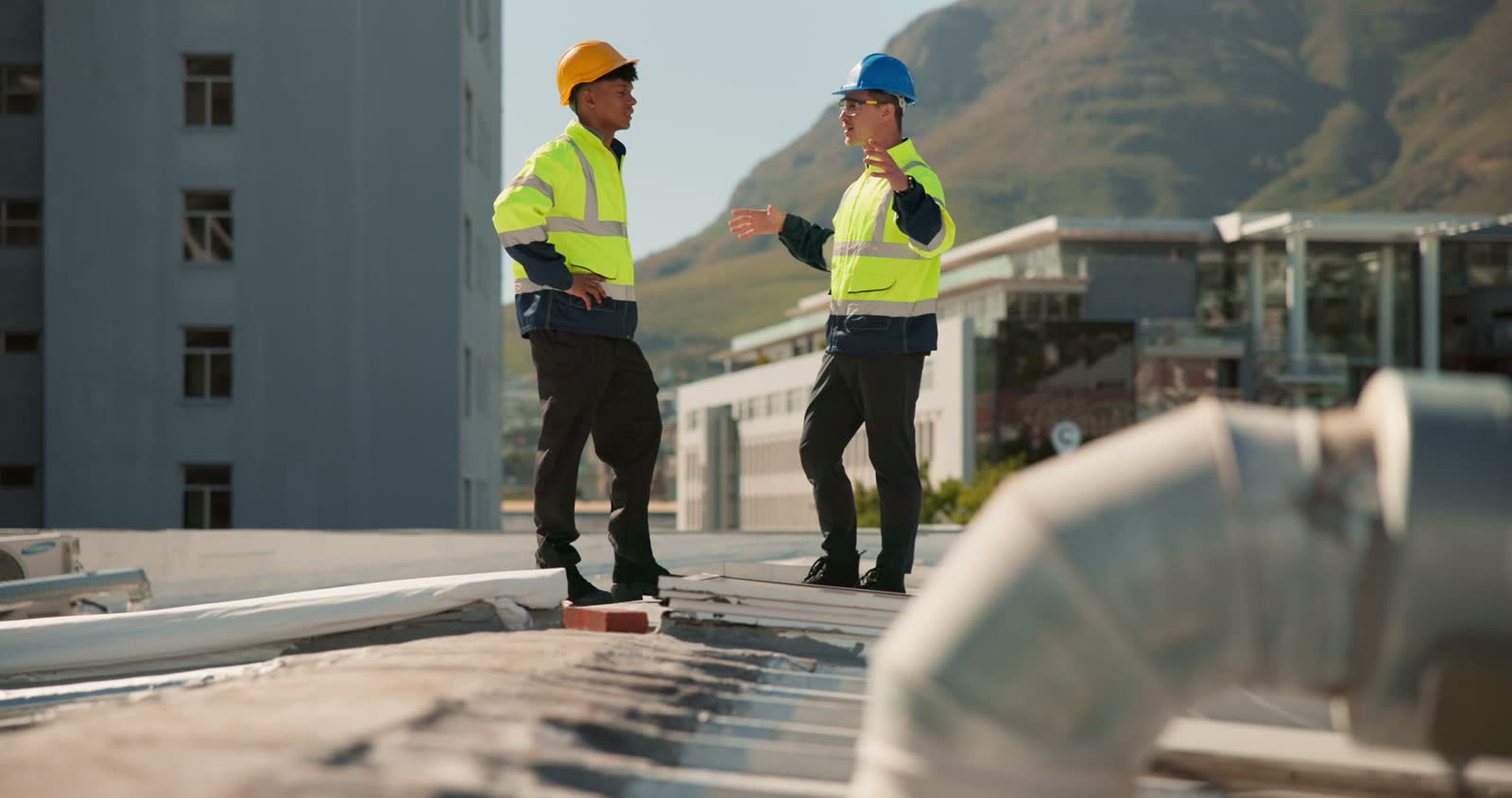 construction-workers-discussing-project-on-buildin.mp4