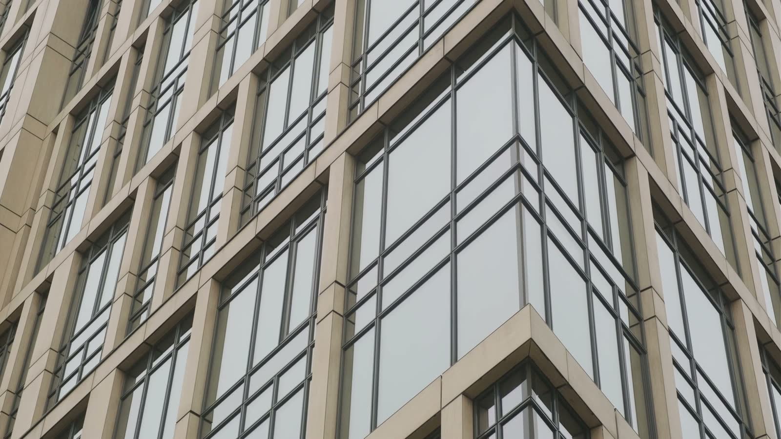facade-of-modern-highrise-building-with-glass-wind.mp4