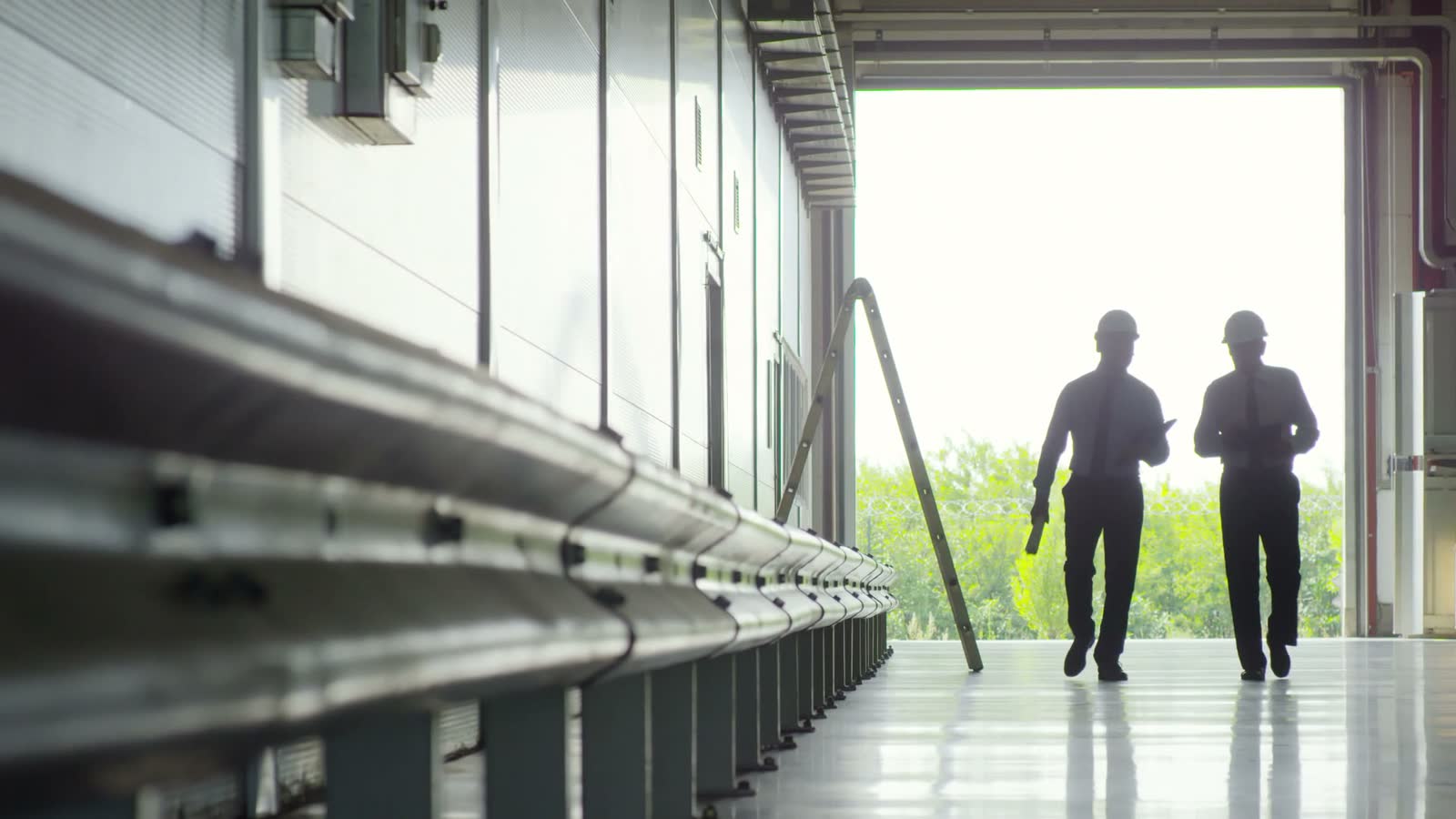 inspectors-entering-spacious-industrial-warehouse.mp4