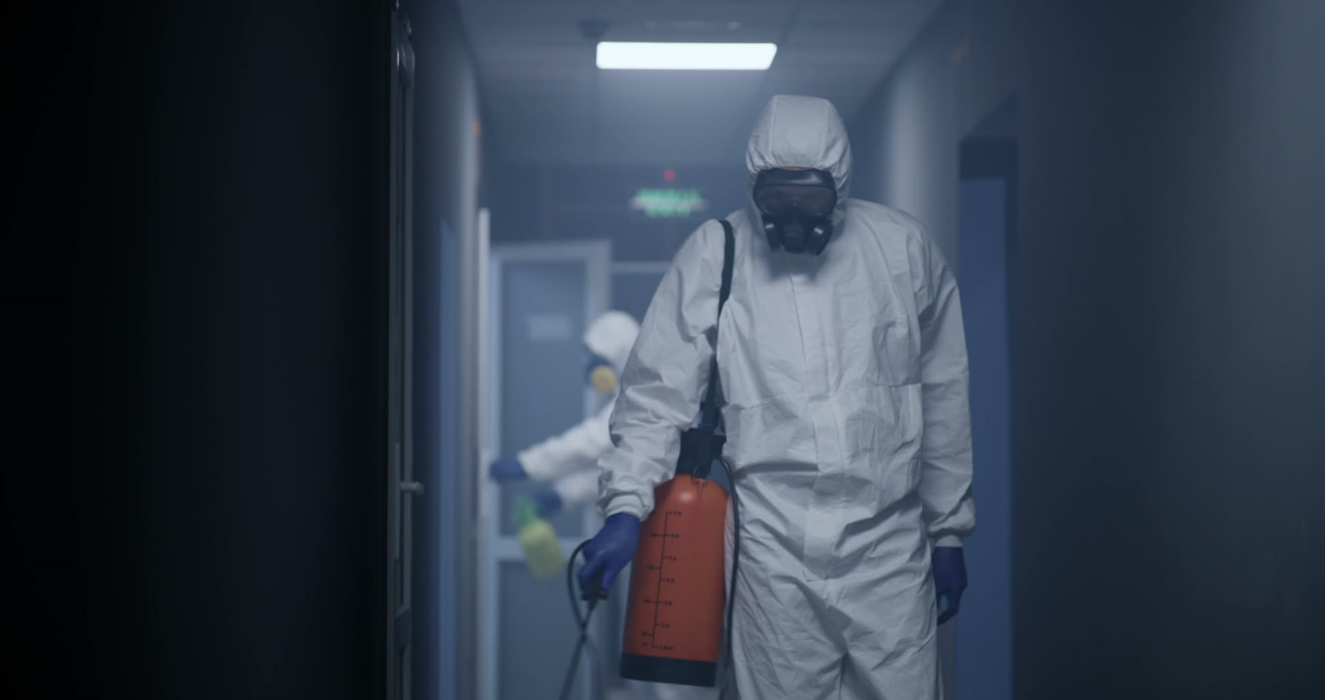 men-in-hazmat-suits-disinfecting-building.mp4