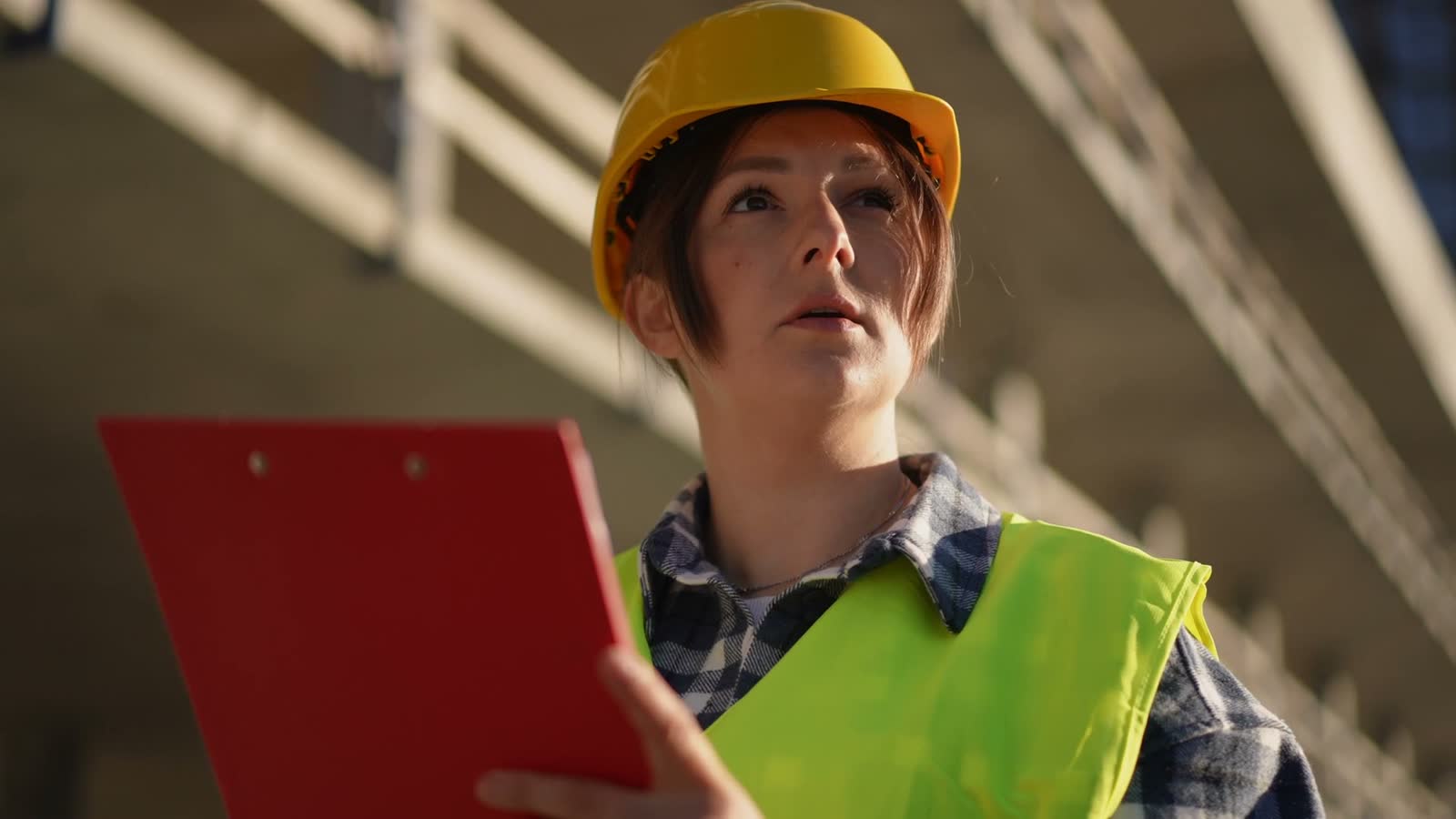 woman-inspects-construction-site-with-clipboard.mp4