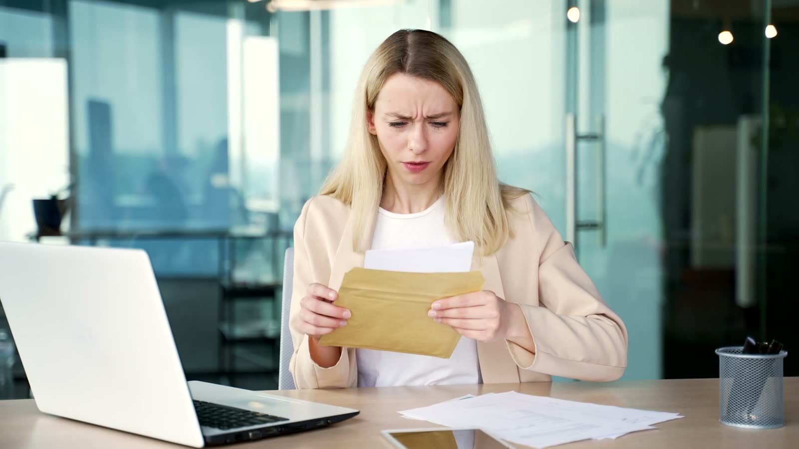 woman-shocked-by-documents-in-modern-office.mp4