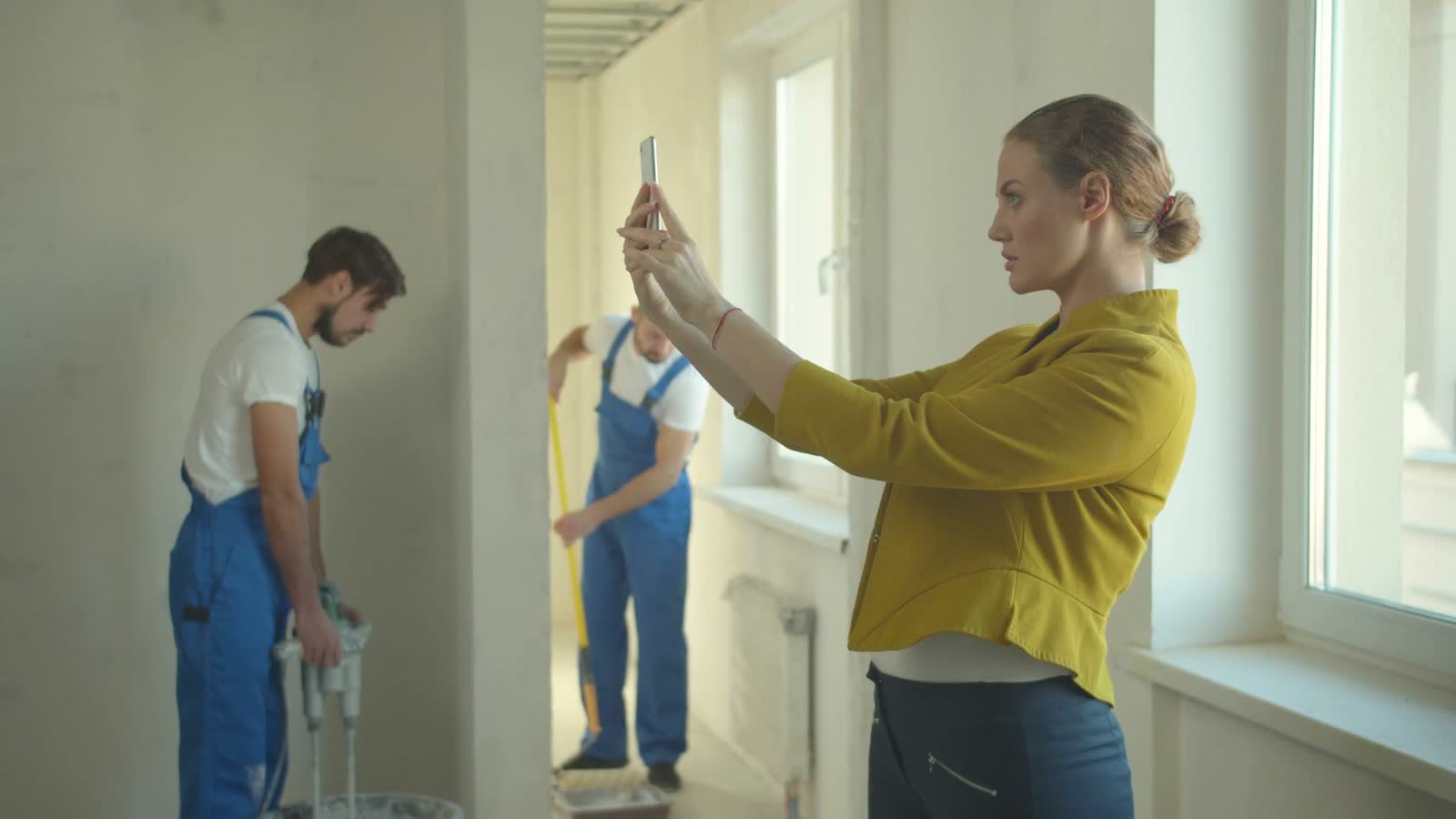 woman-supervises-construction-workers-renovating-h.mp4