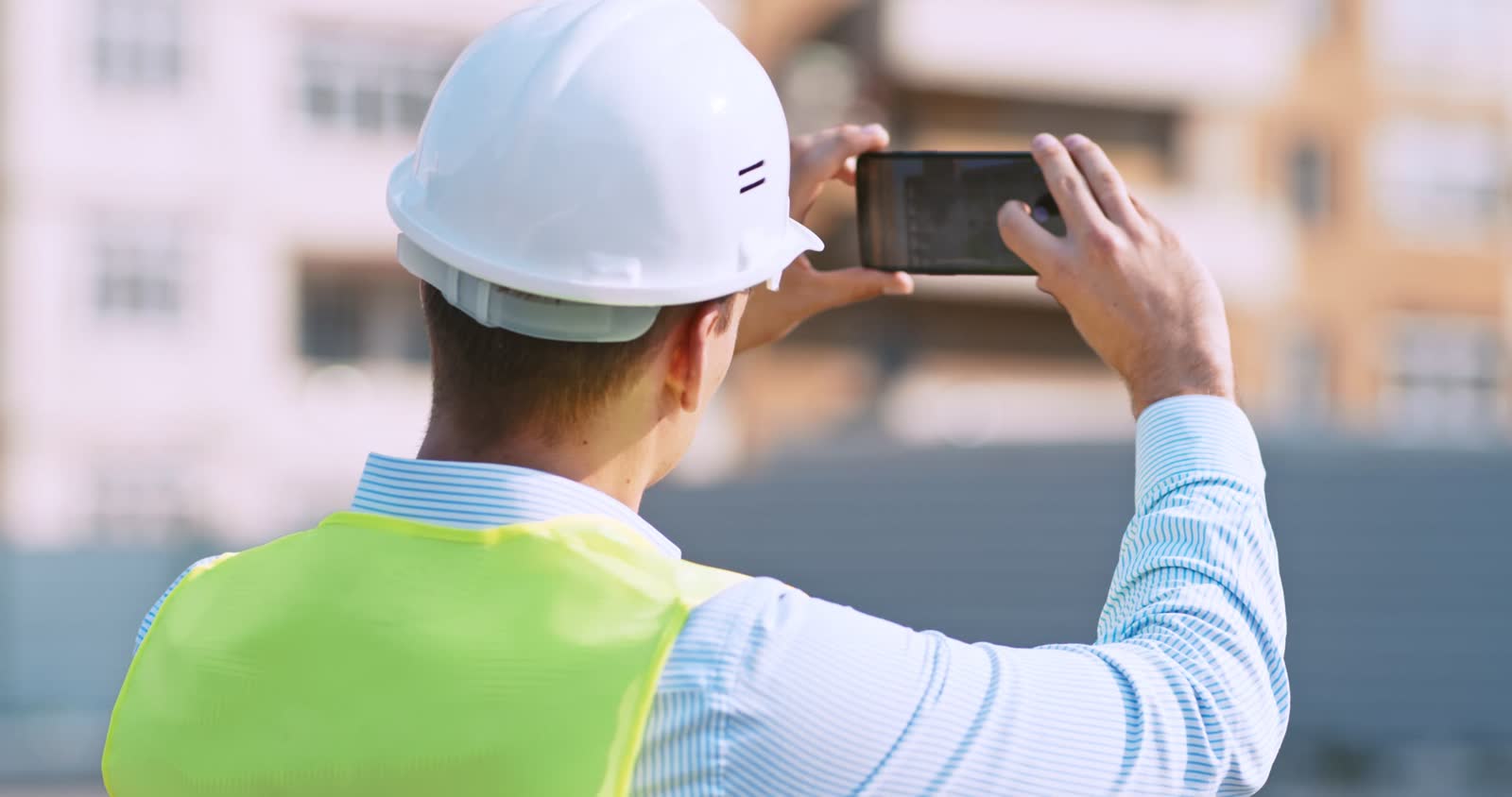 worker-at-construction-site-making-photos-on-his-c.mp4