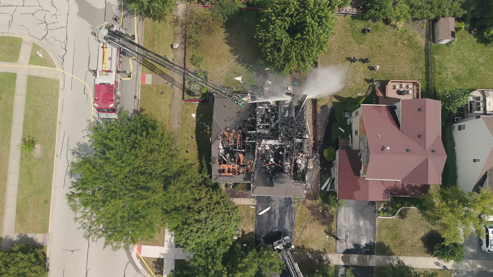 aerial-drone-shot-of-smoke-from-after-a-house-fire.mp4