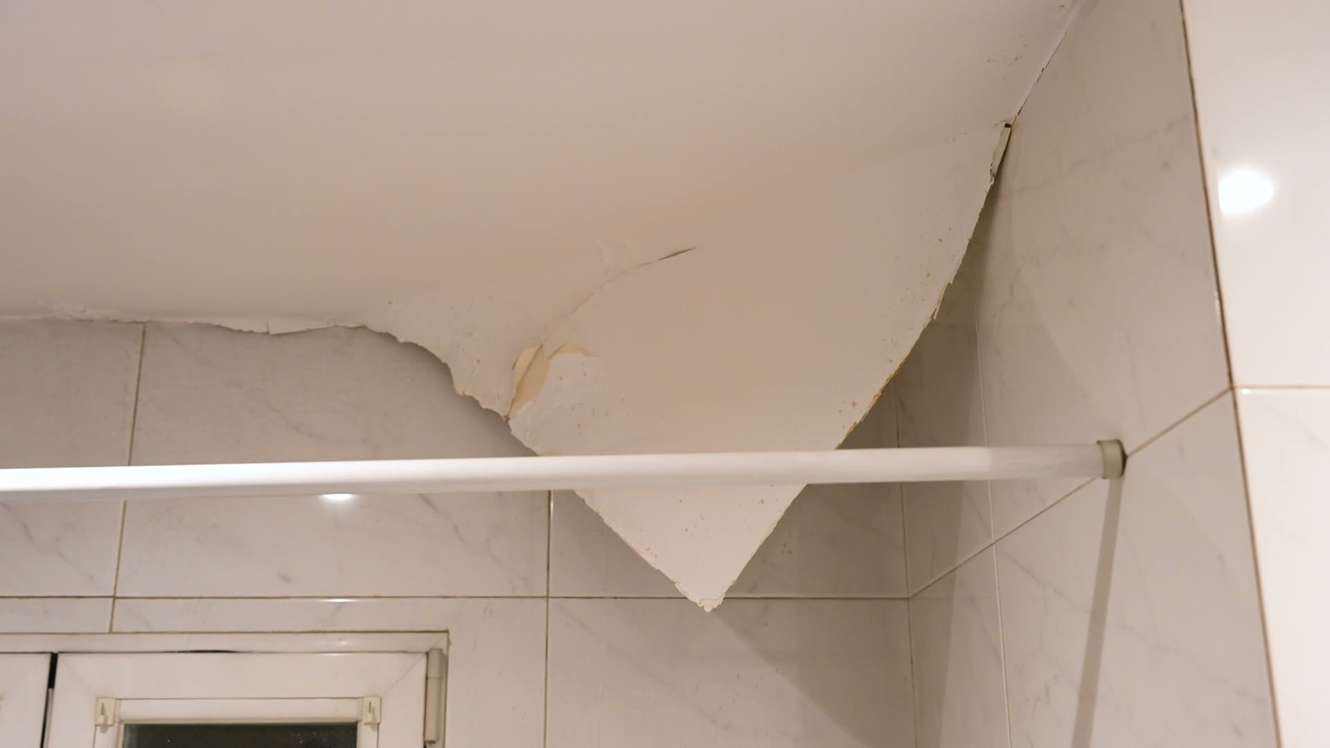 bathroom-ceiling-with-water-damage-and-peeling-pai.mp4