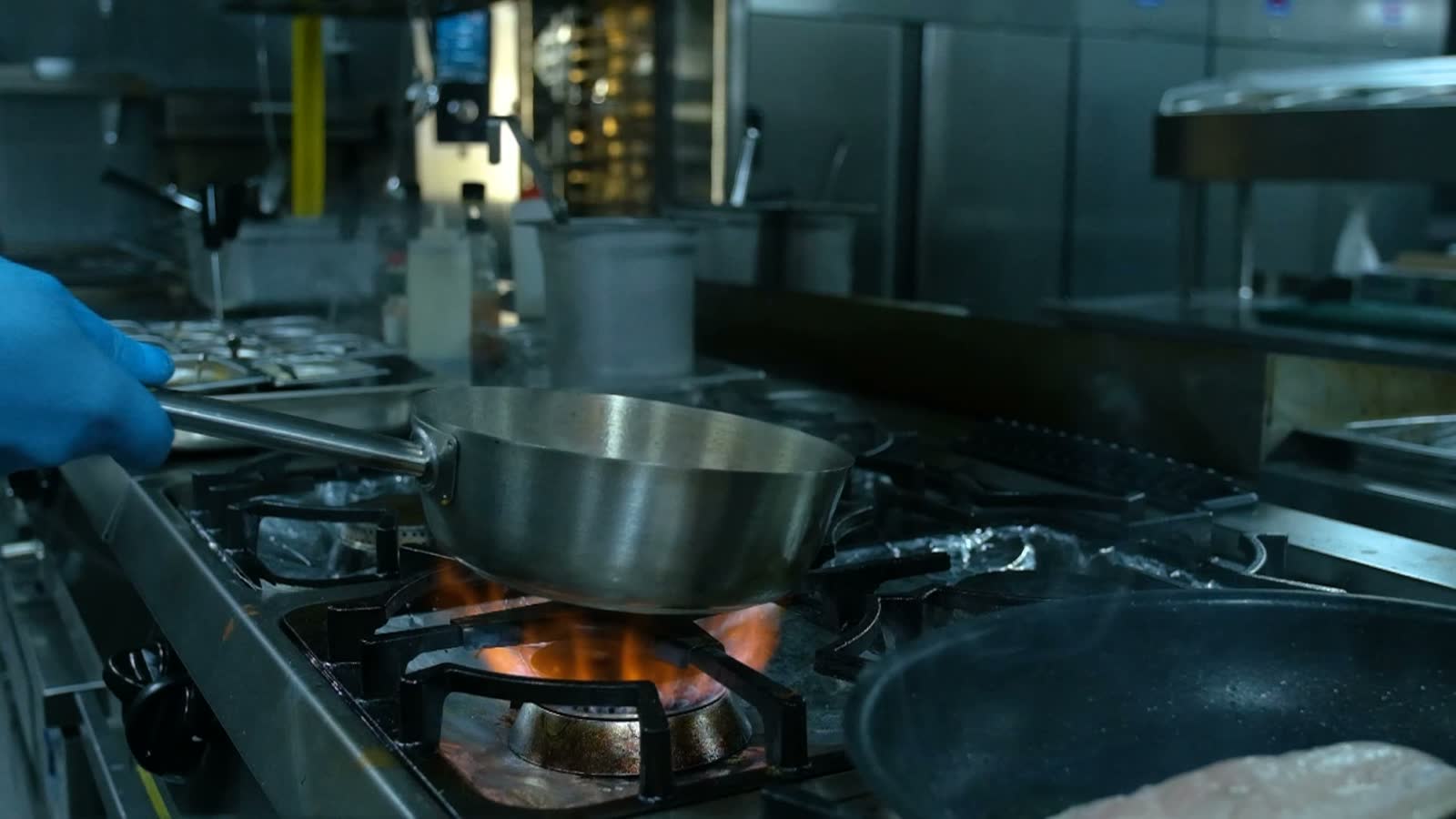 close-up-of-a-restaurant-chef-cooking-food-on-fire.mp4