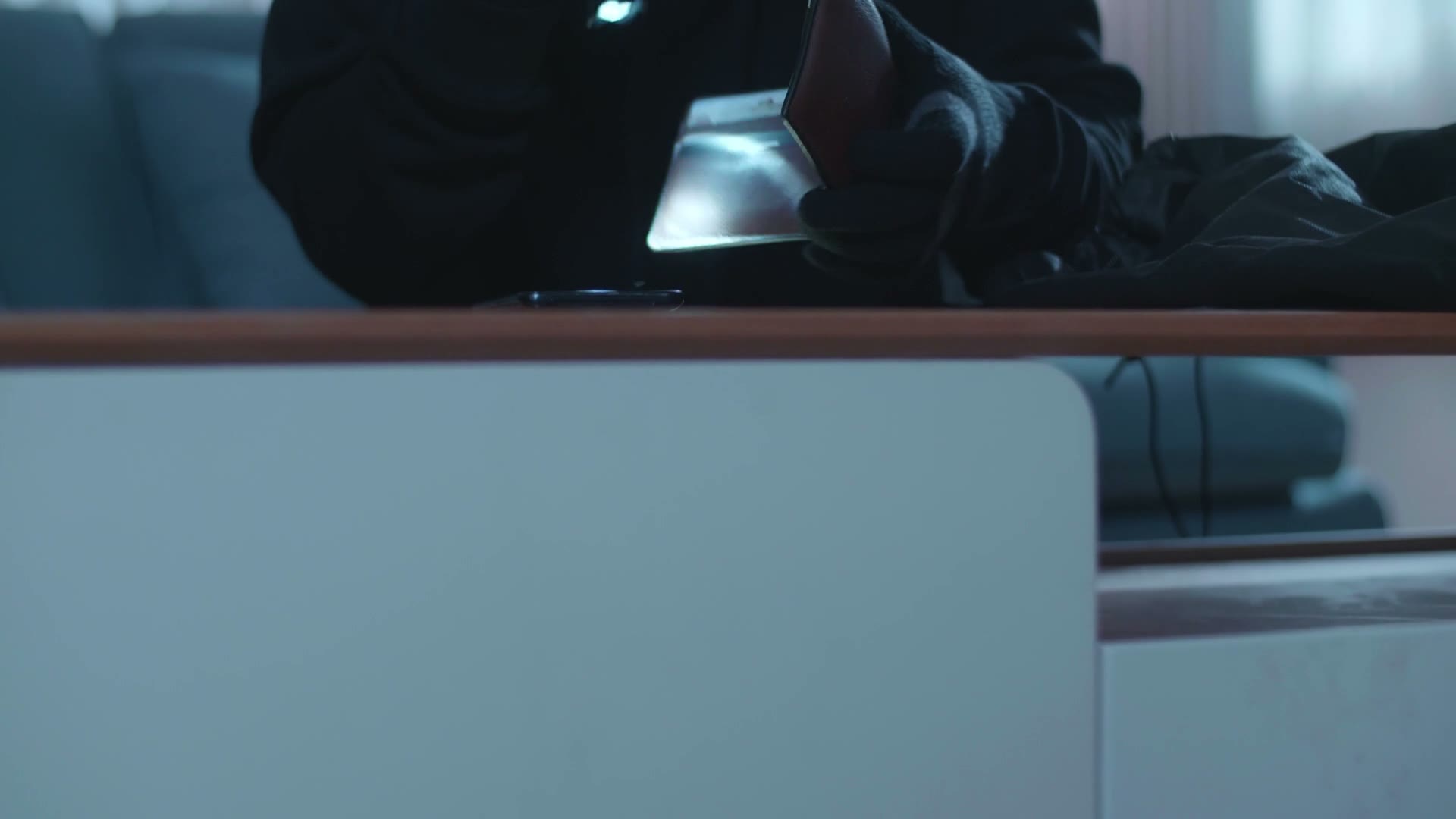 close-up-of-a-thief-man-holding-flashlight-stealin.mp4