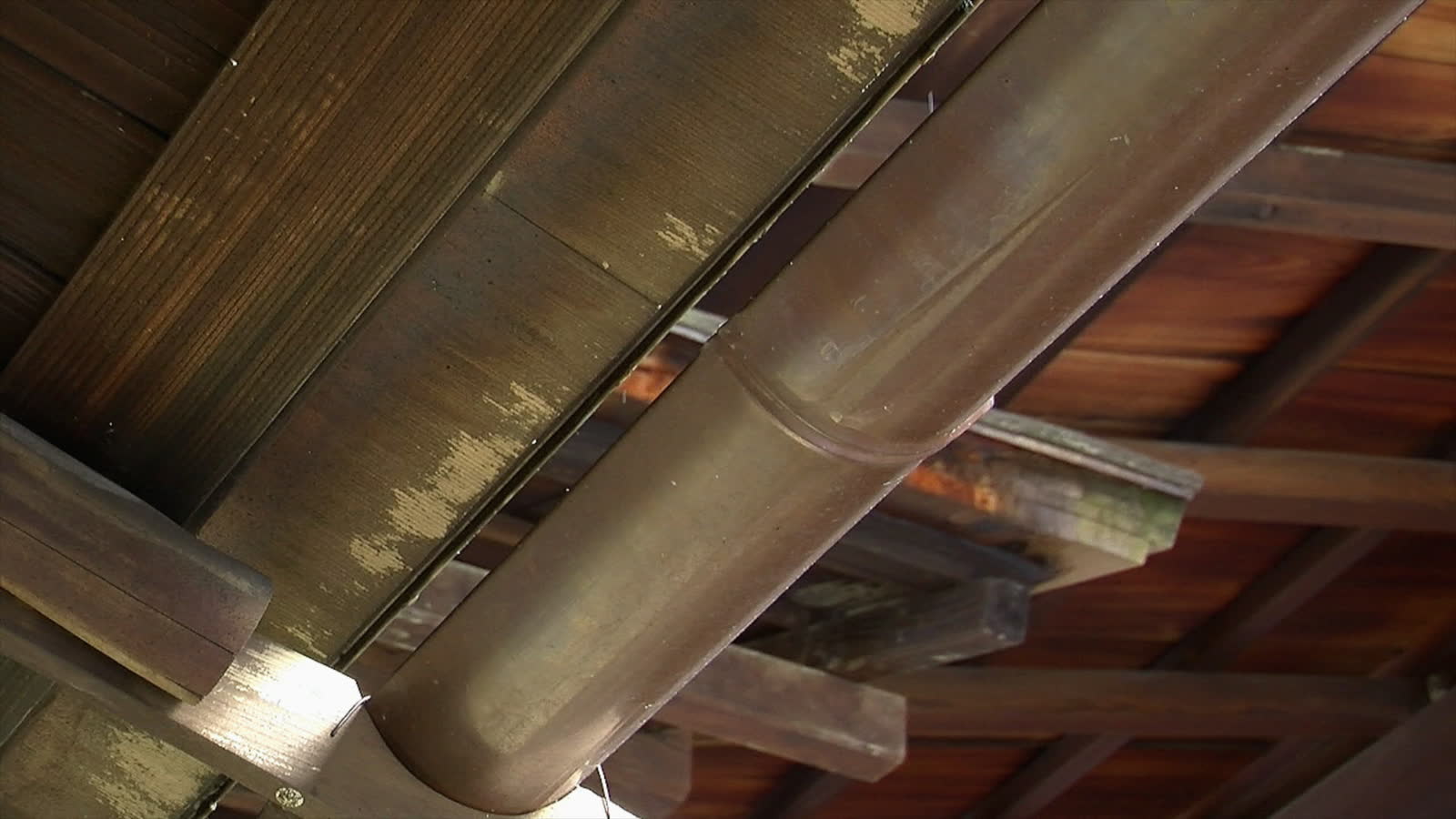 Supply pipe running through wood framing inside a wall cavity