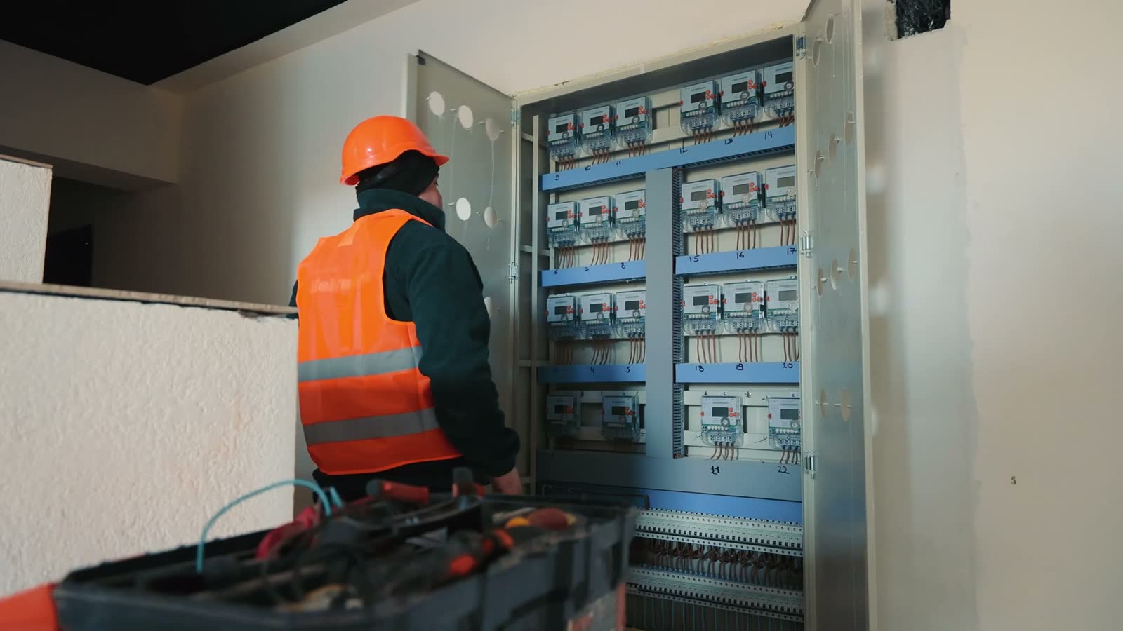 electrician-working-on-electrical-panel-in-workpla.mp4