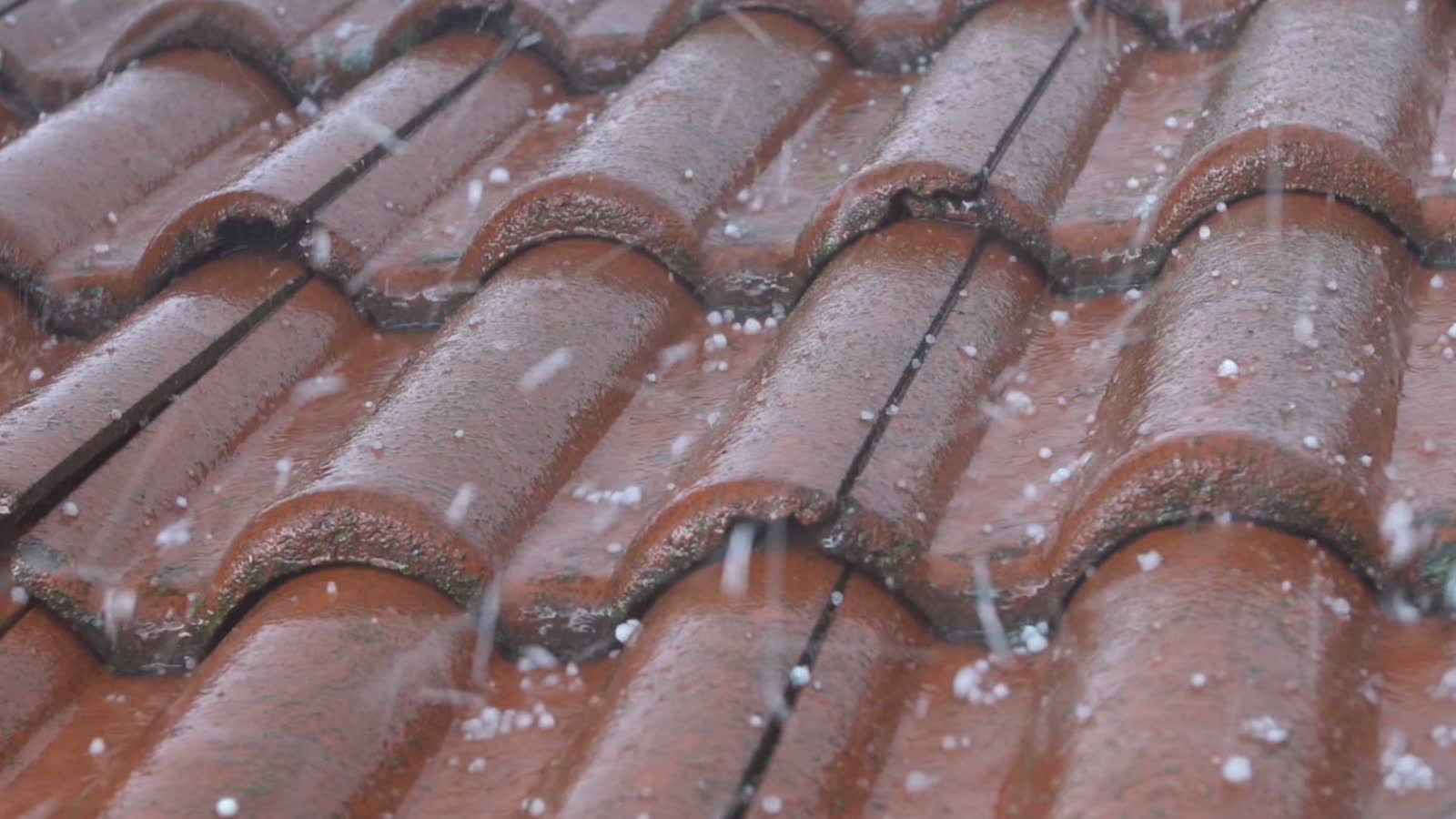 hail-falling-on-a-tiled-roof.mp4