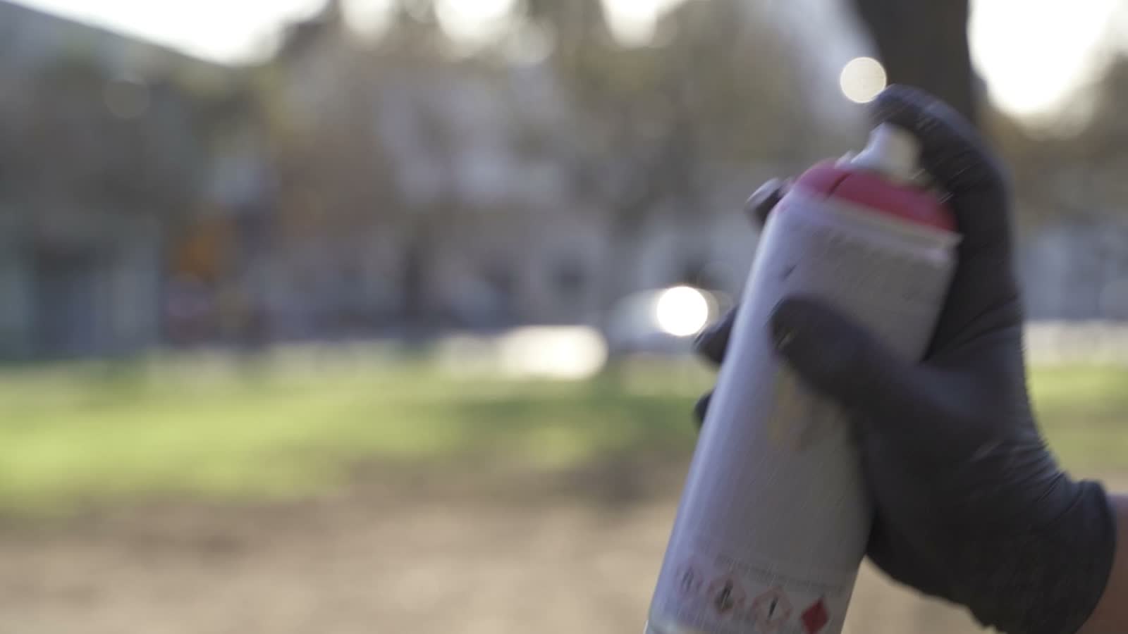 hand-sprays-pink-paint-from-graffiti-can.mp4