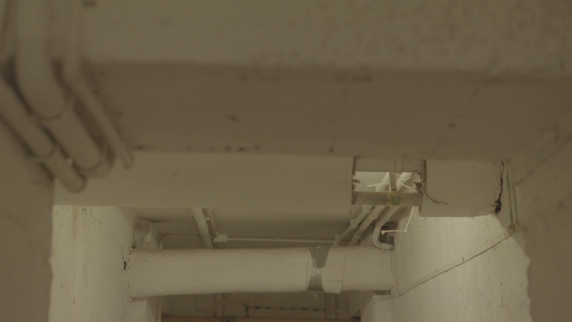 indoor-hallway-with-ceiling-pipes.mp4