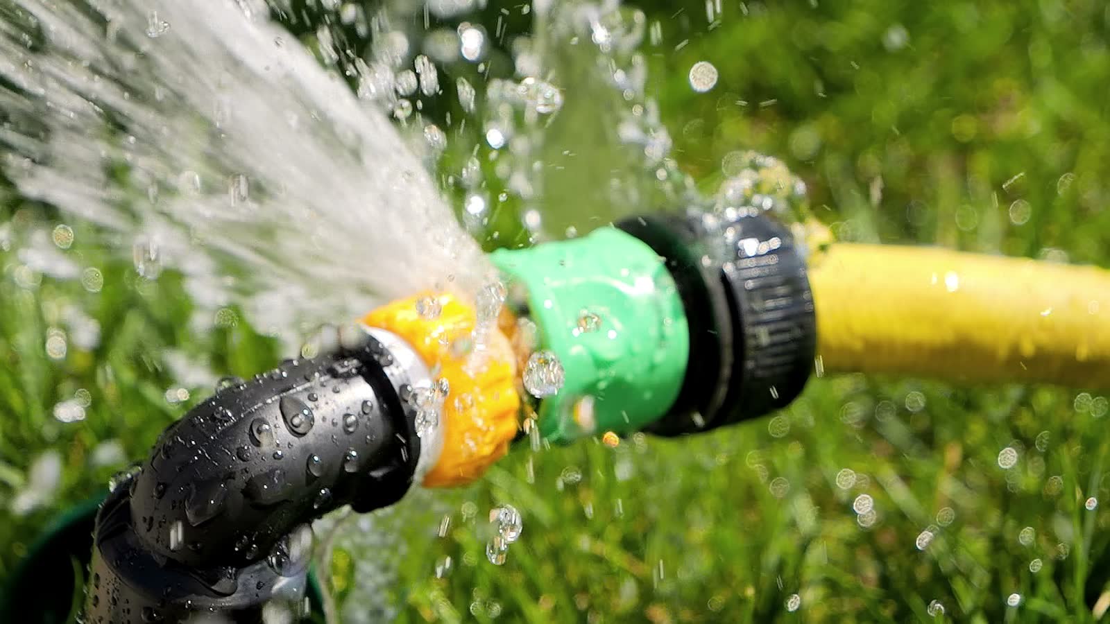 leaking-water-hose-in-green-garden-setting.mp4