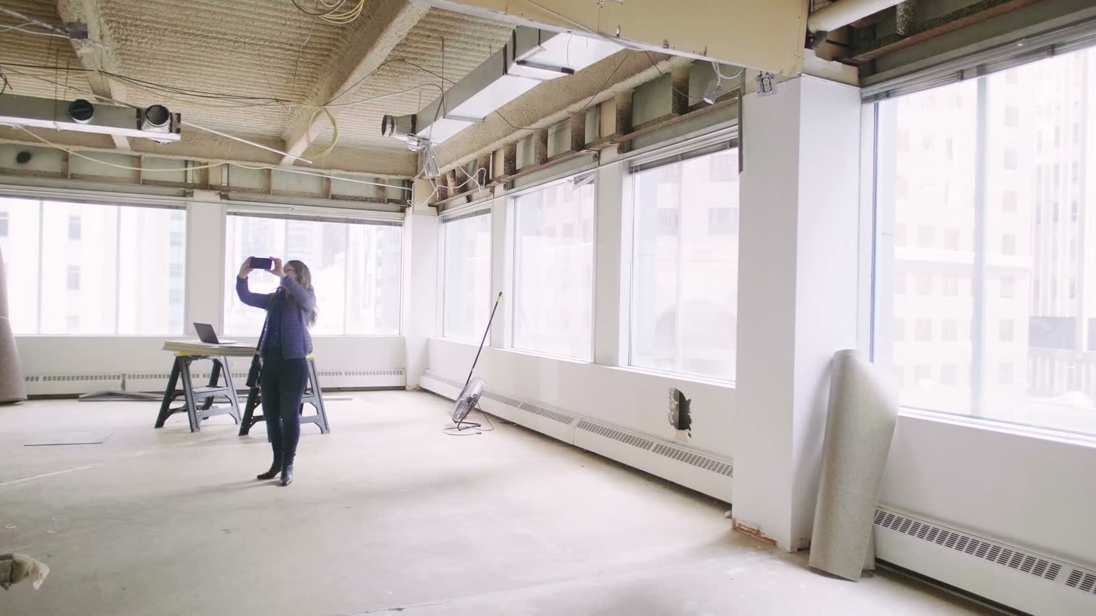 of-architect-taking-photo-of-empty-office-ceiling.mp4