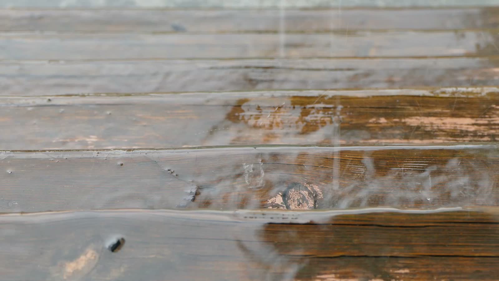 rain-drips-on-wet-wood-surface.mp4