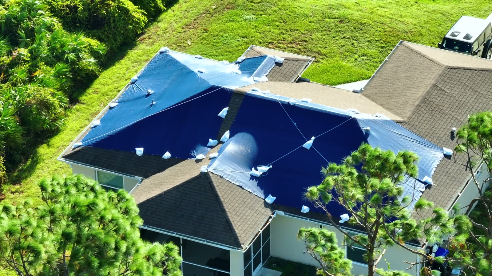 top-view-of-leaking-house-roof-covered-with-protec.mp4