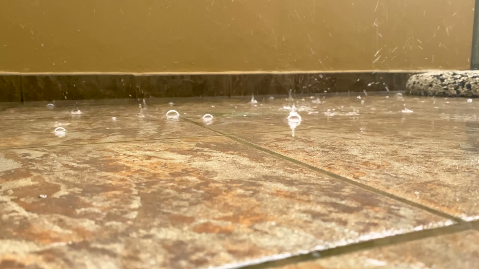 water-dripping-and-splashing-on-tiled-floor.mp4