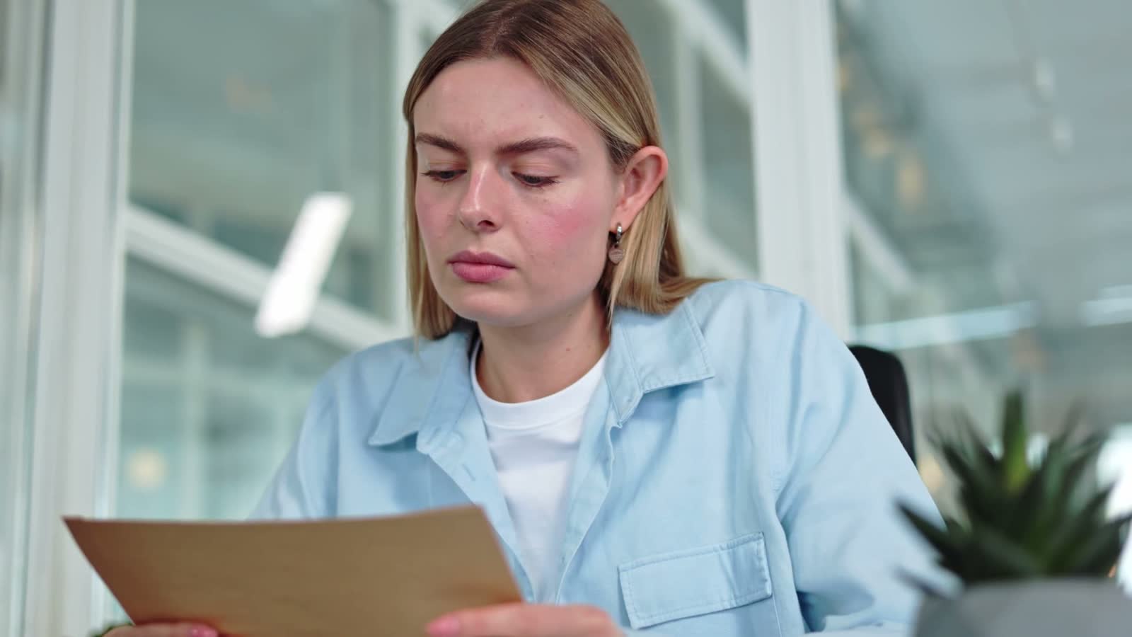 calm-female-reading-shocked-news-in-received-mail.mp4