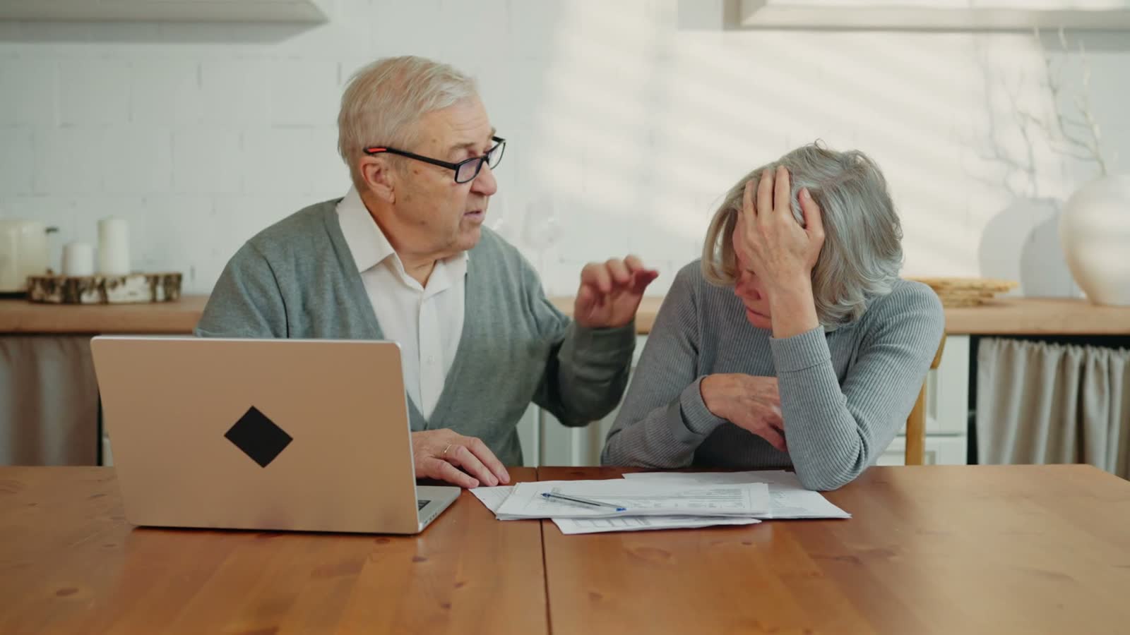 depressed-old-woman-looking-at-utility-bills-and-b.mp4