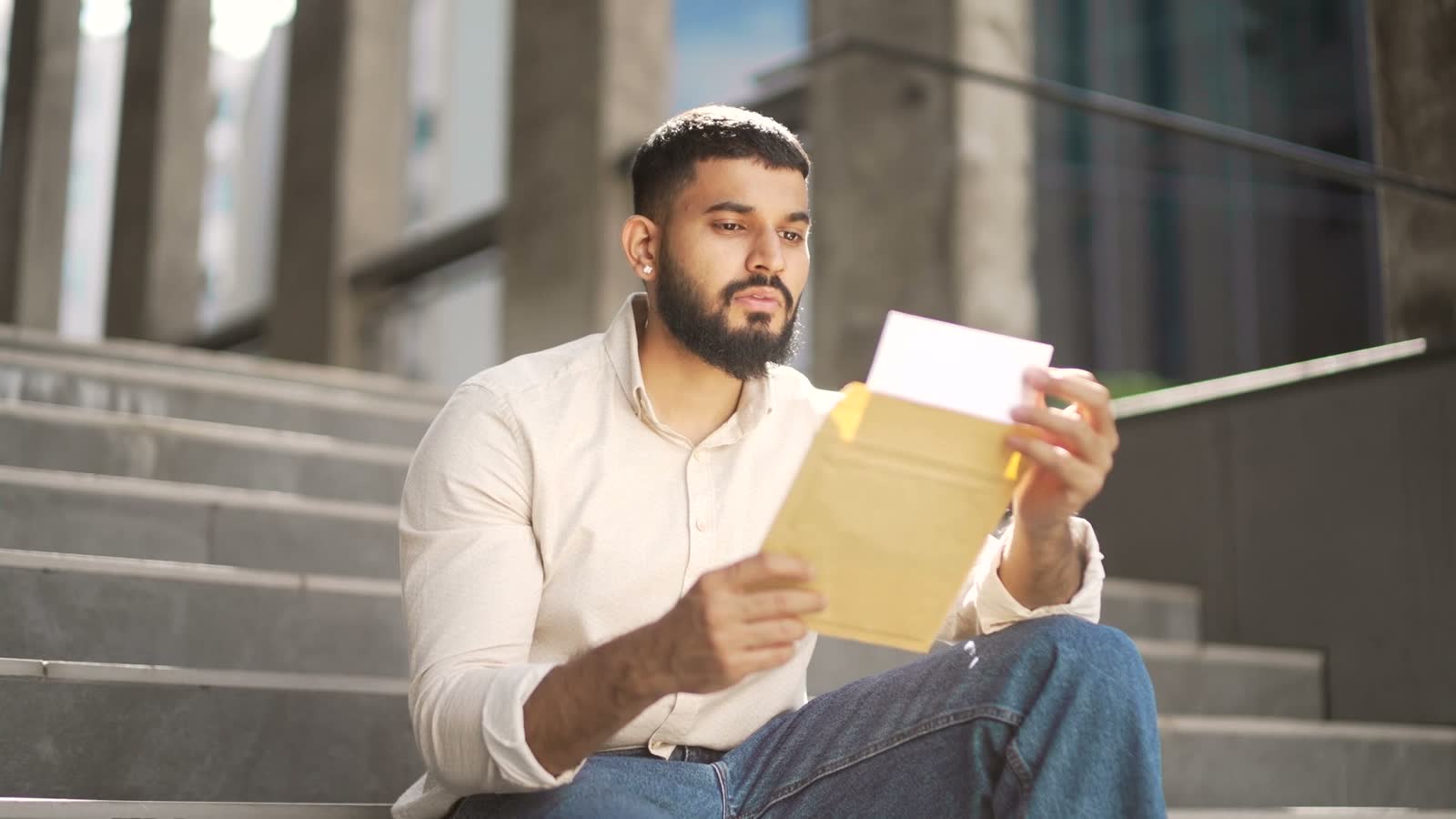 disappointed-adult-man-reading-letter-with-bad-new.mp4