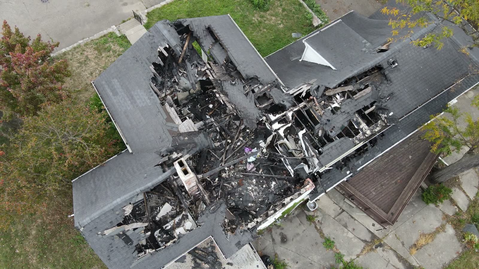 family-disaster-burned-down-home-aerial-top-dow.mp4