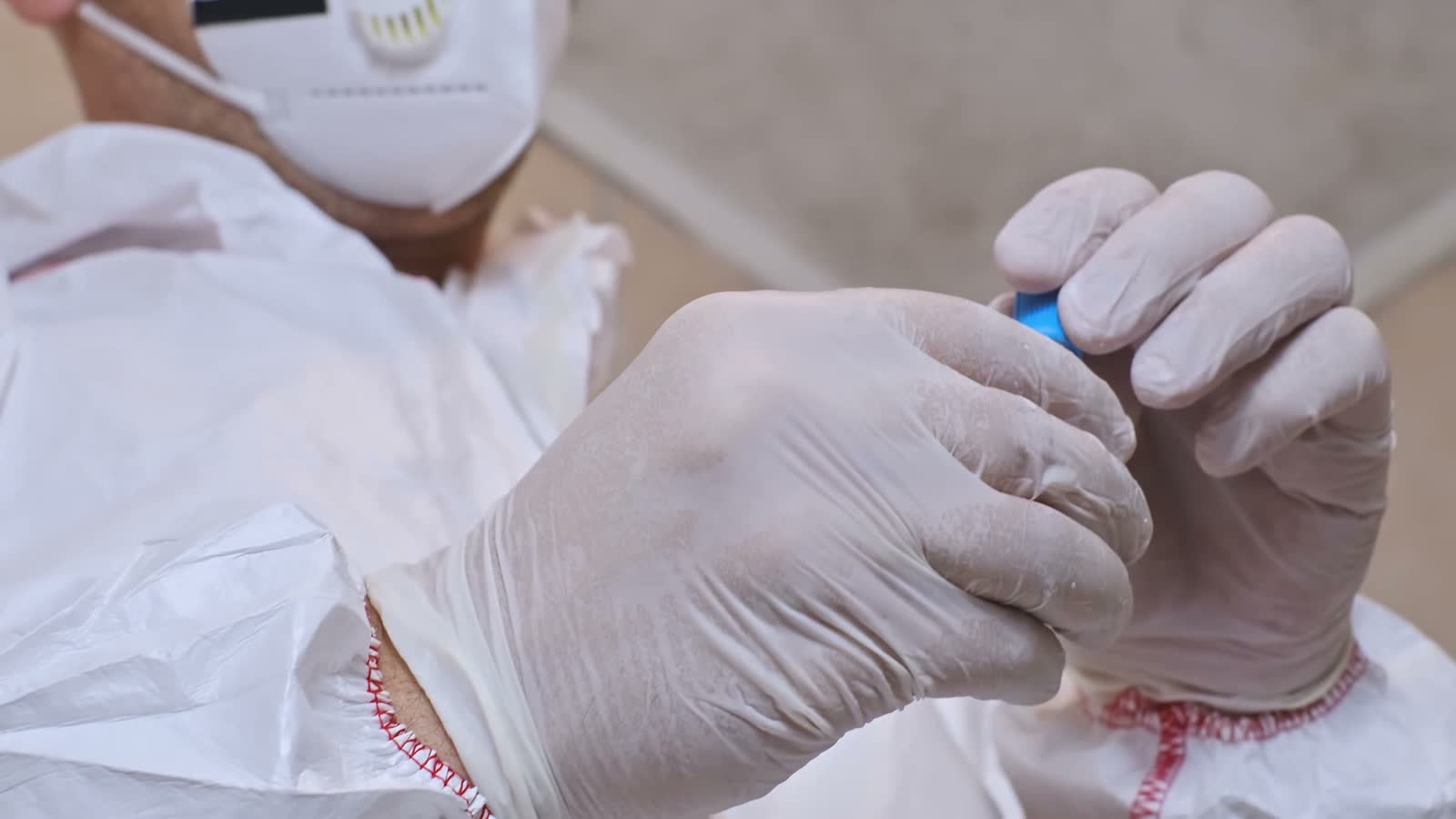 healthcare-worker-examining-vile-of-medication.mp4