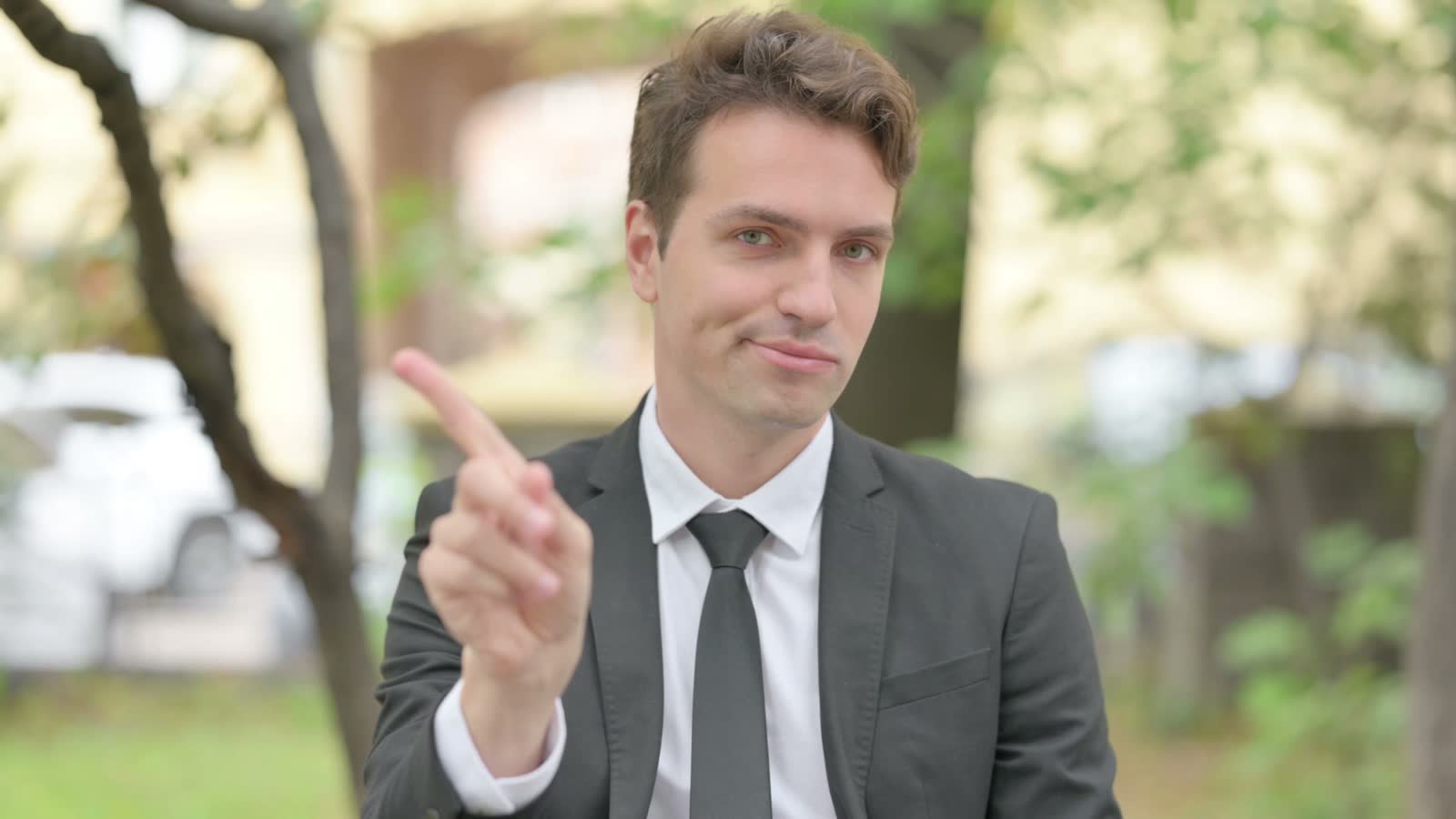 man-in-suit-gesturing-no-outdoors.mp4