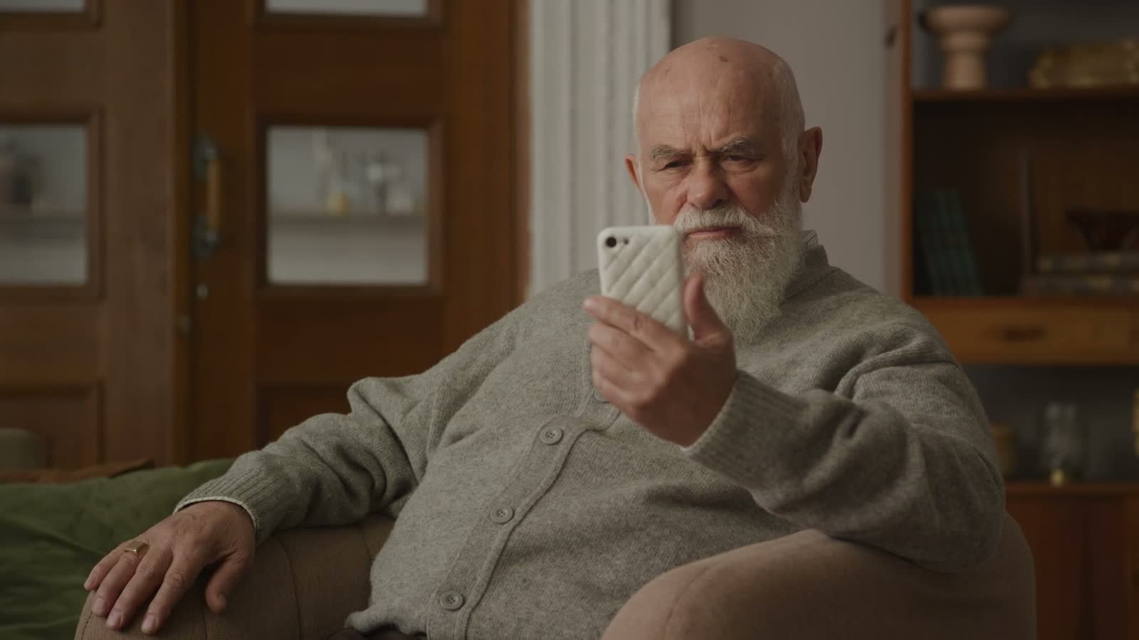 senior-man-using-smartphone-with-upset-expression.mp4