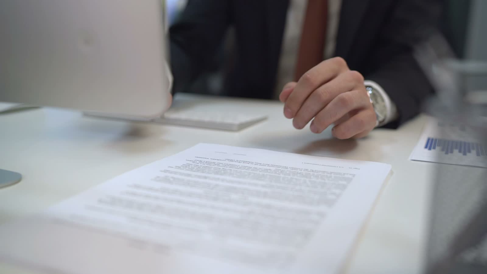 Policyholder reviewing claim paperwork at a desk