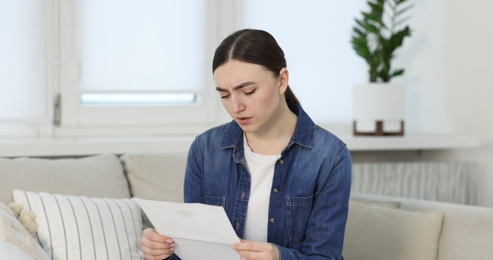 upset-woman-reading-rejection-letter-from-universi.mp4