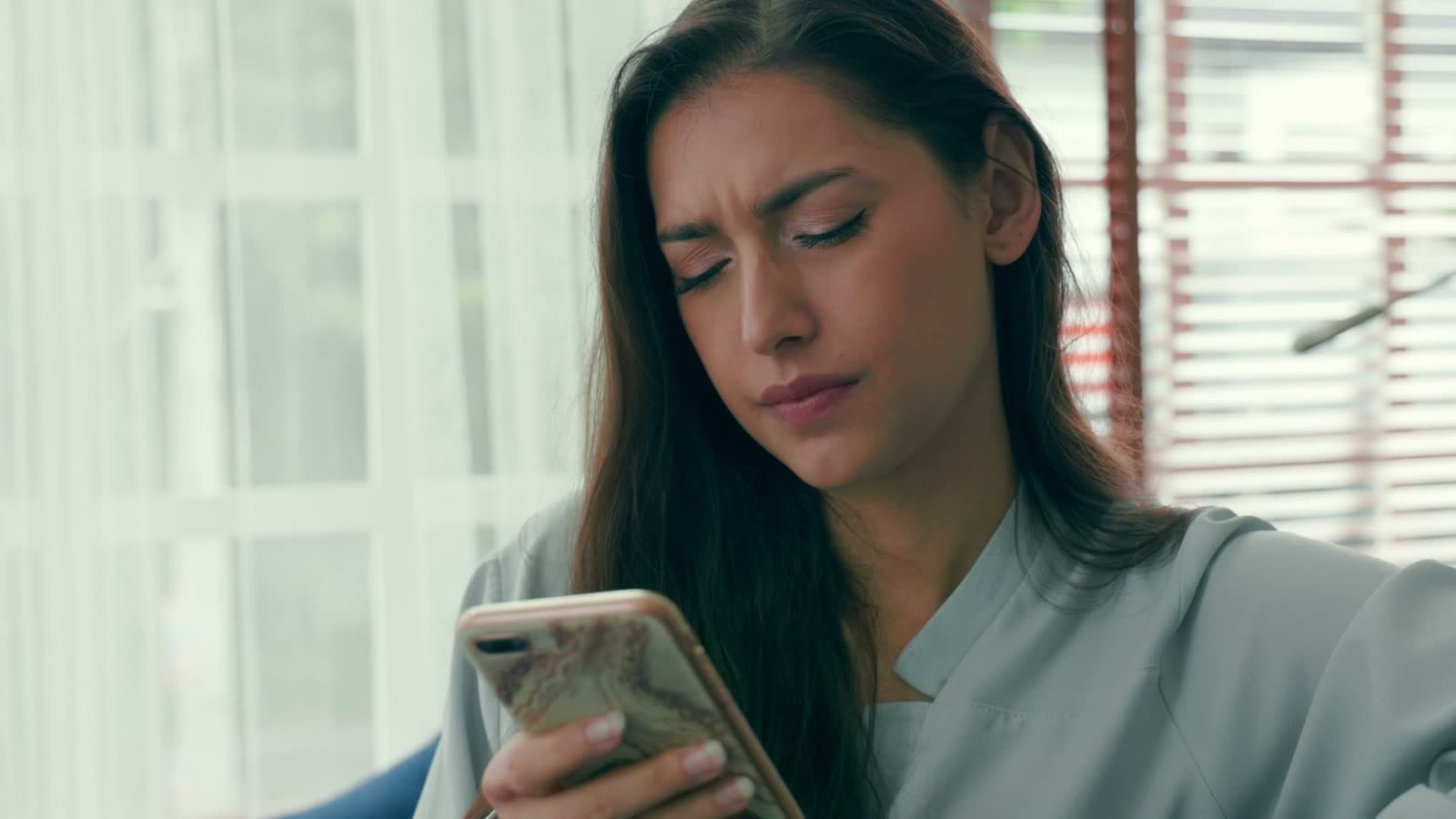 woman-looking-frustrated-while-using-her-smartphon.mp4