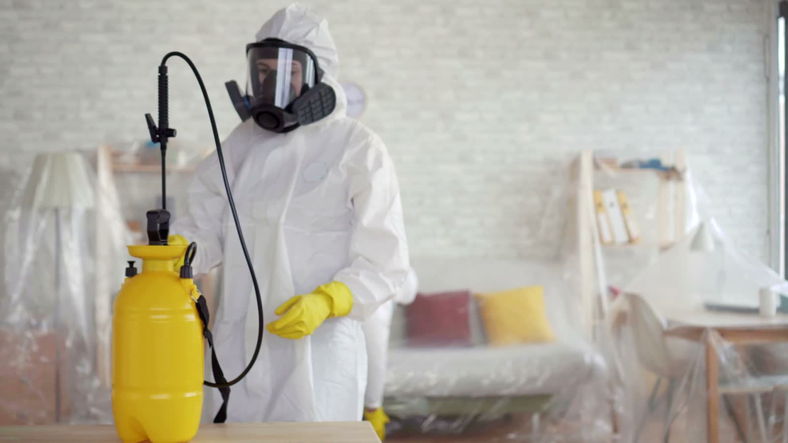 workers-in-protective-suits-disinfecting-interior.mp4