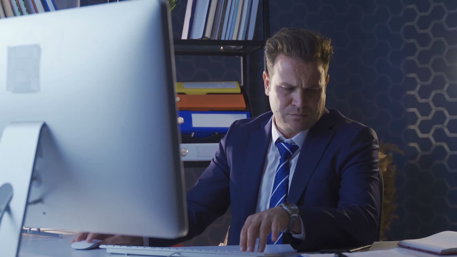 worried-businessman-working-at-computer-at-night.mp4