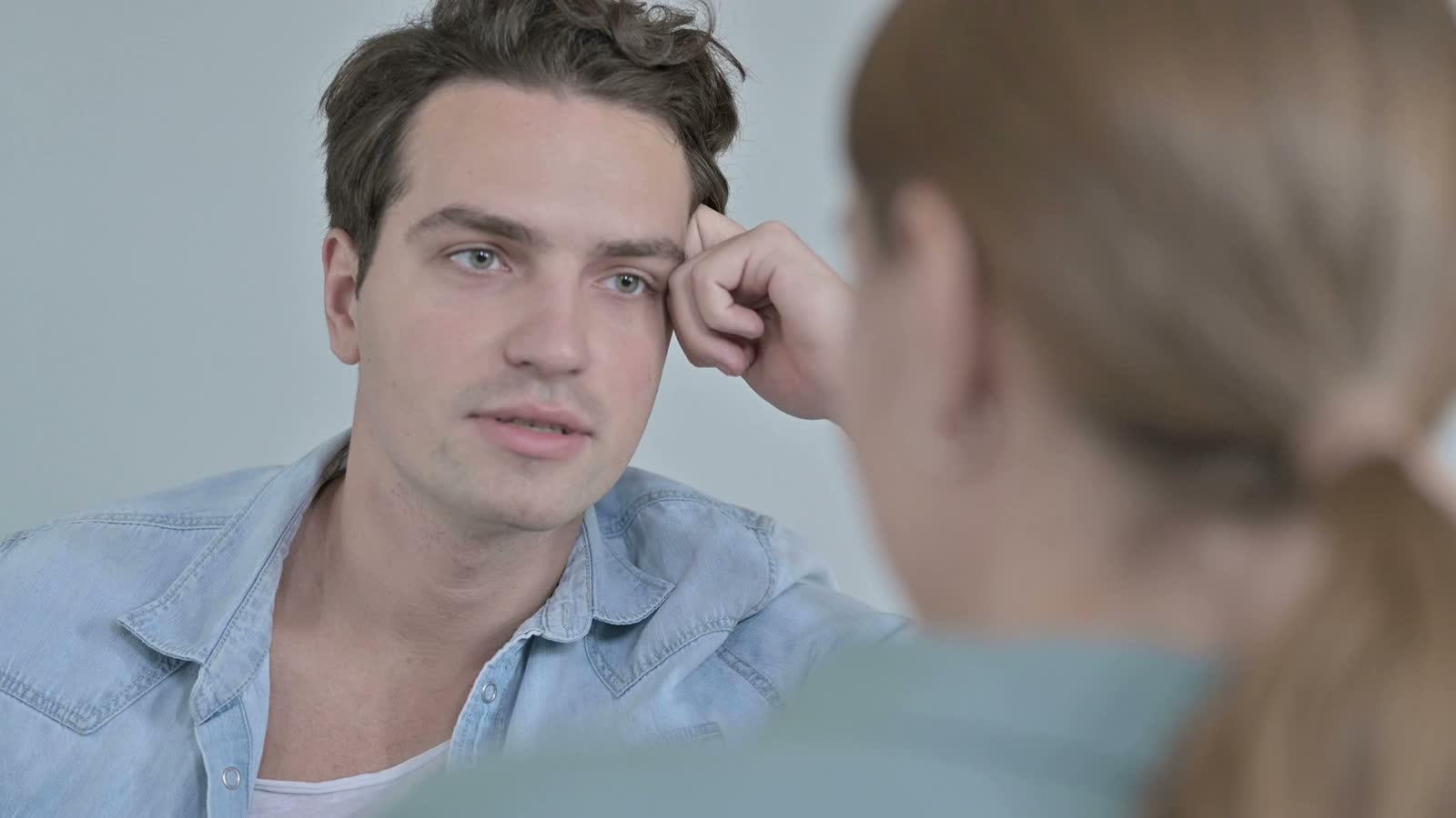 young-man-listening-intently-in-close-up.mp4