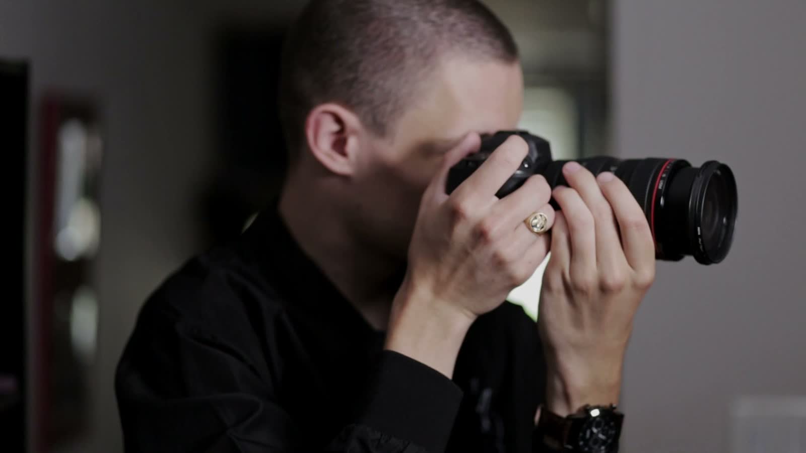 young-man-using-digital-camera-indoors.mp4
