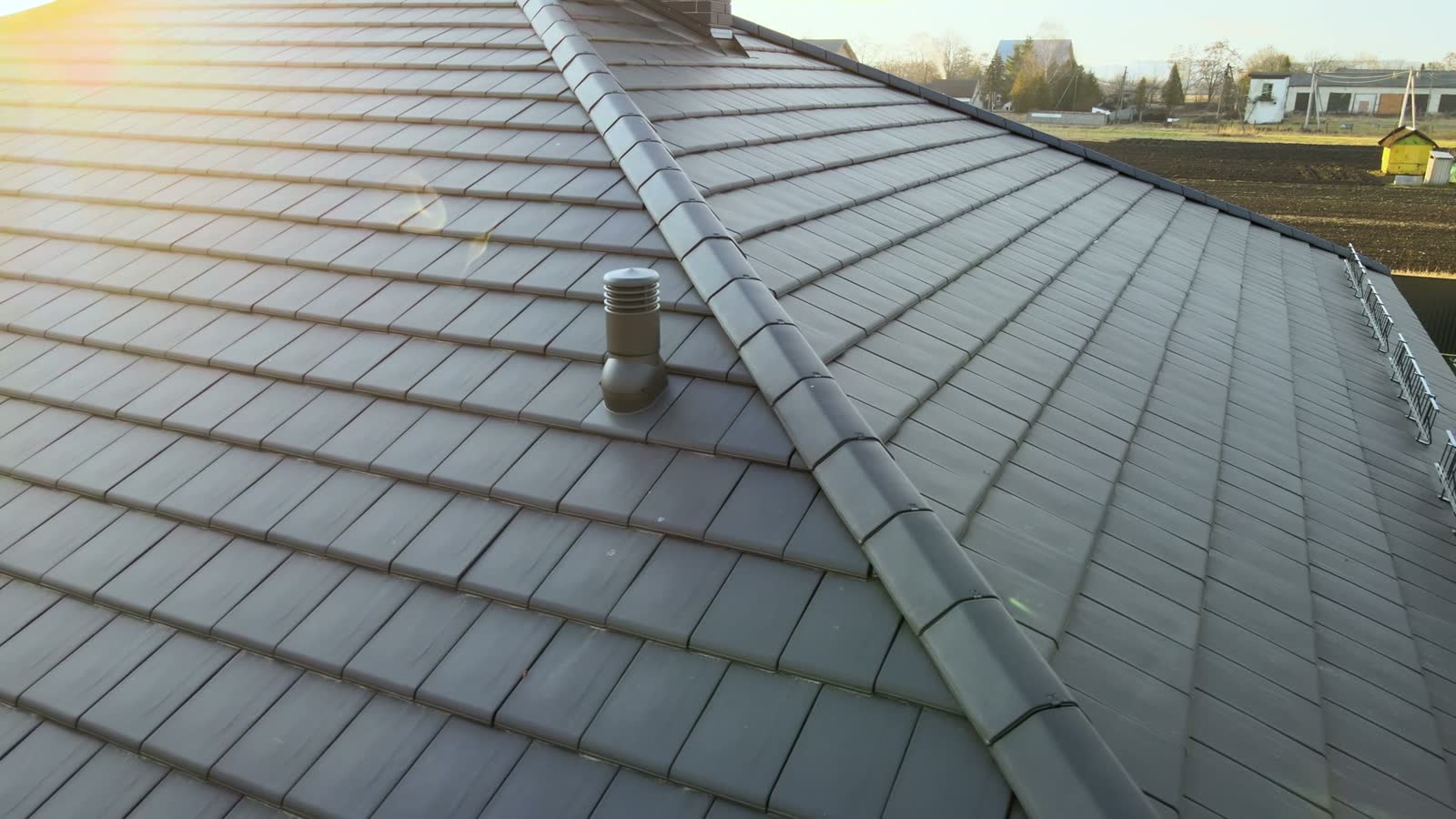 aerial-view-of-a-tiled-roof-at-sunrise.mp4